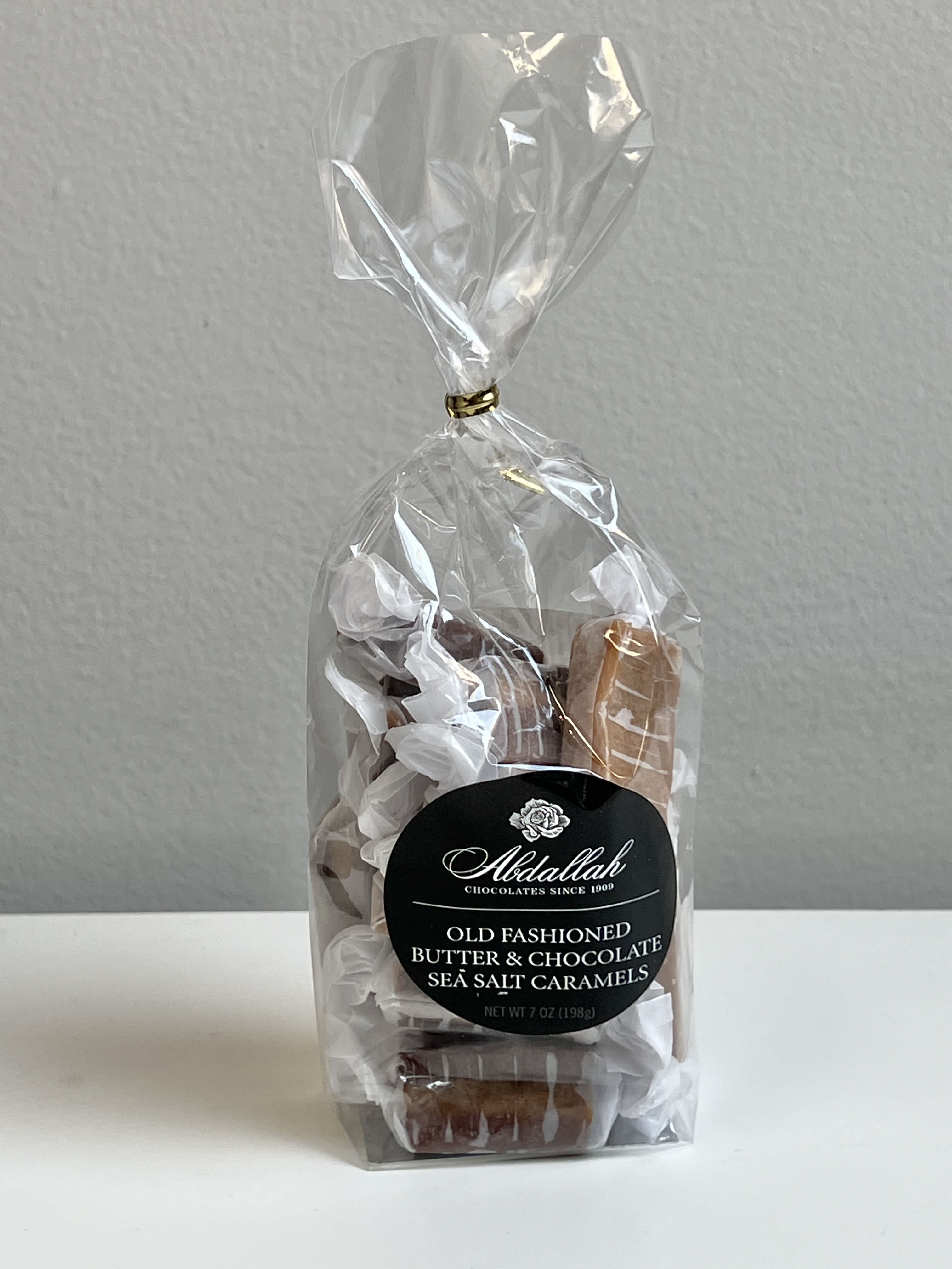 Bag of wrapped sea salt caramels with a black label