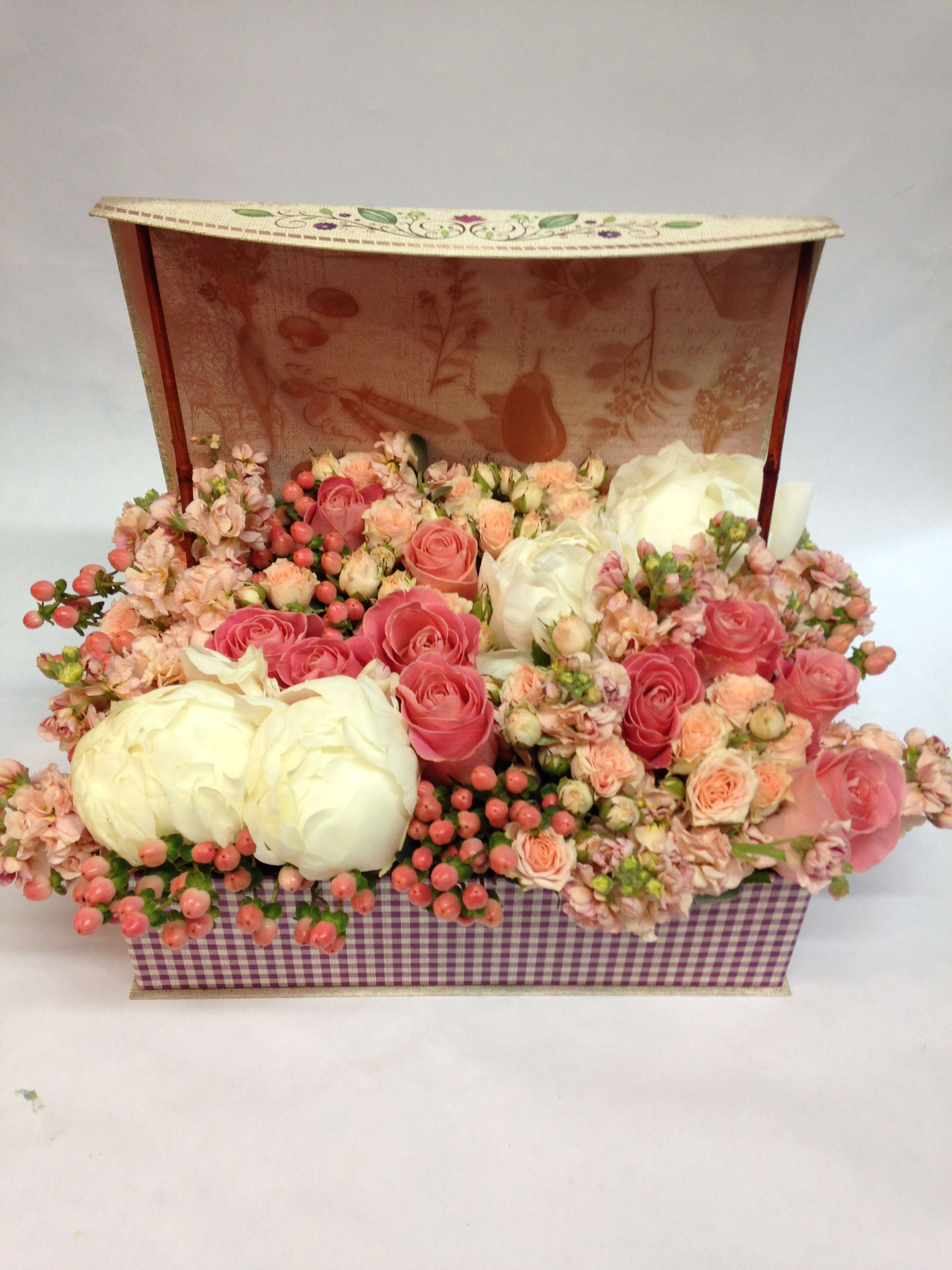 Pink and white rose arrangement in a decorative gift box