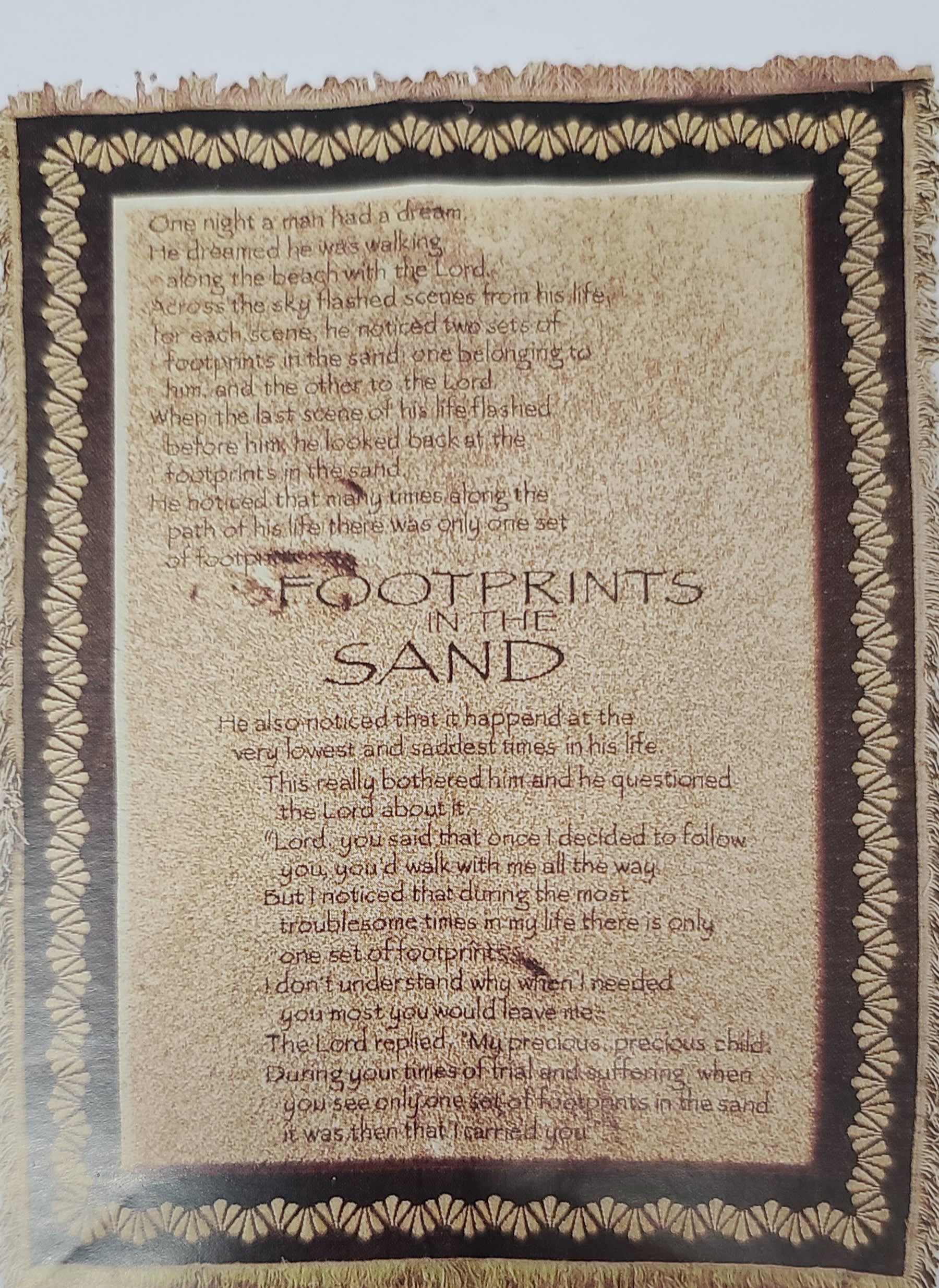 Framed wall hanging with the poem "Footprints in the Sand"