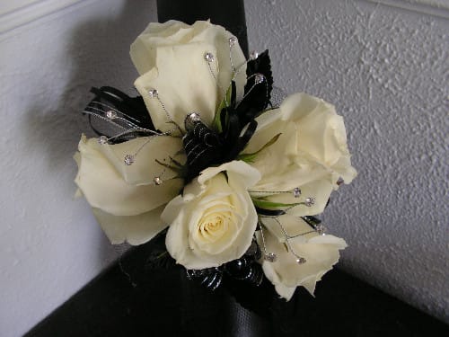Cream rose bouquet with black ribbon and jeweled accents