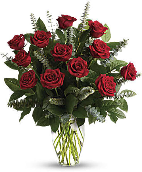 Bouquet of red roses in a clear glass vase
