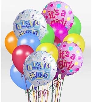 Cluster of colorful birthday balloons, including two "it's a boy" and two "it's a girl" balloons