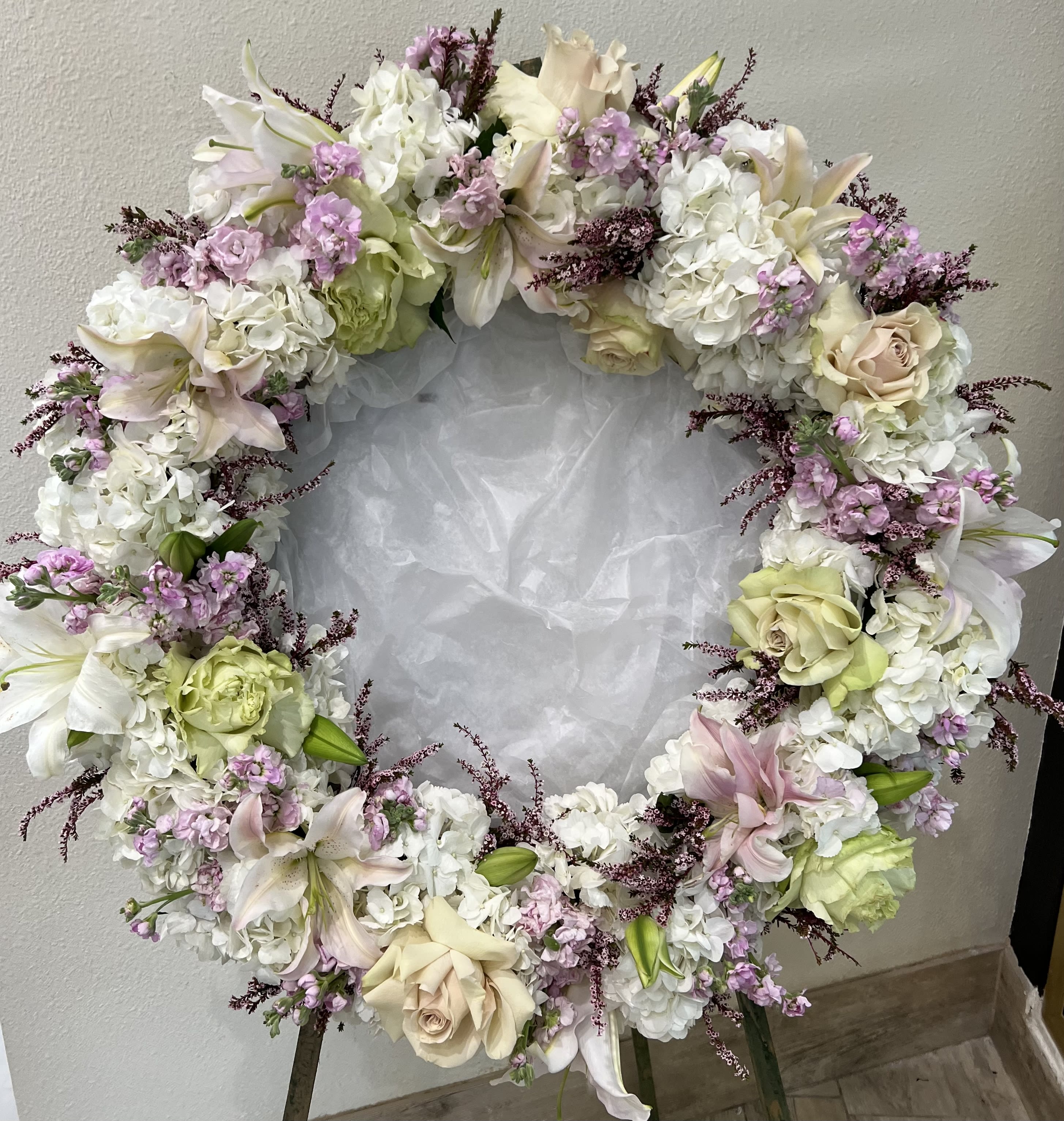 Heart-shaped floral wreath with white, blush, and lavender flowers