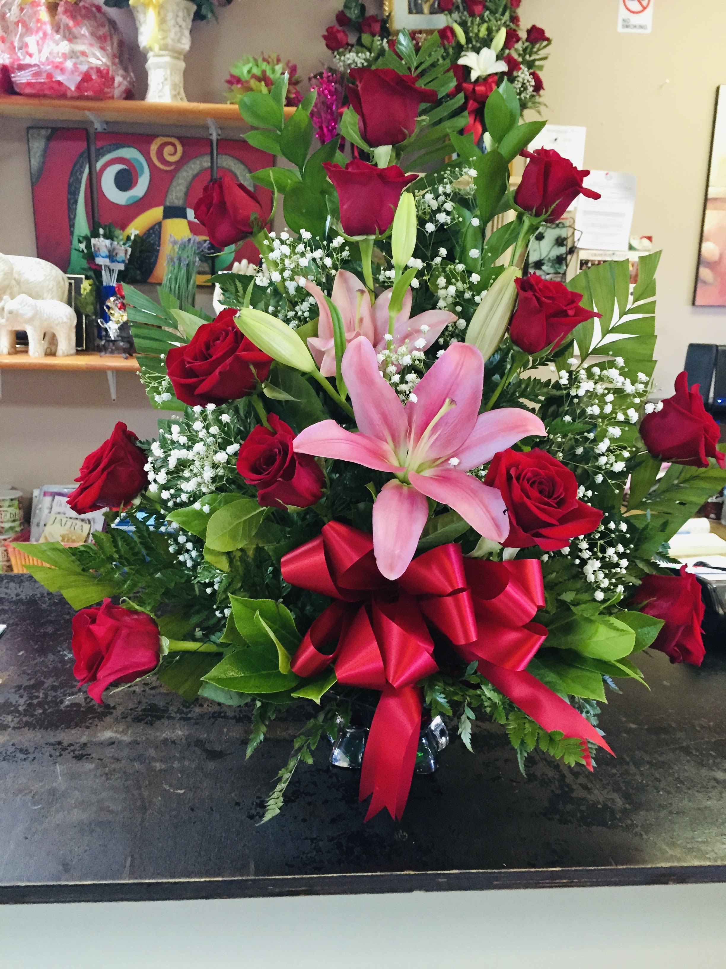 Be Mine by BloomNation™ - If your partner's love language is gifts, don't sweat it. This classic (and big!) arrangement is a perfect way to celebrate and show your love. Whether it be Valentine's Day, an anniversary, or a random Tuesday, this arrangement will be sure to wow.  Approximate Dimensions: 20"D x 25"H