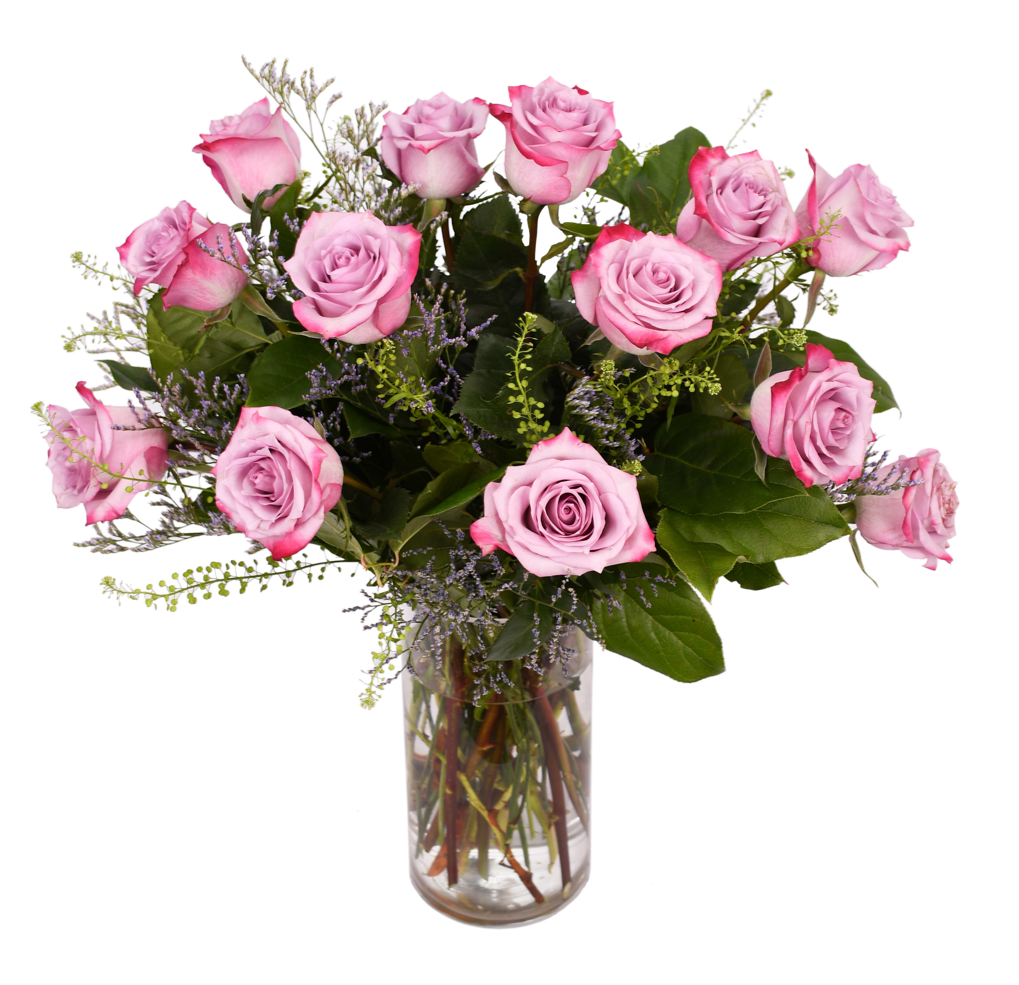 Pink roses arranged in a clear glass vase