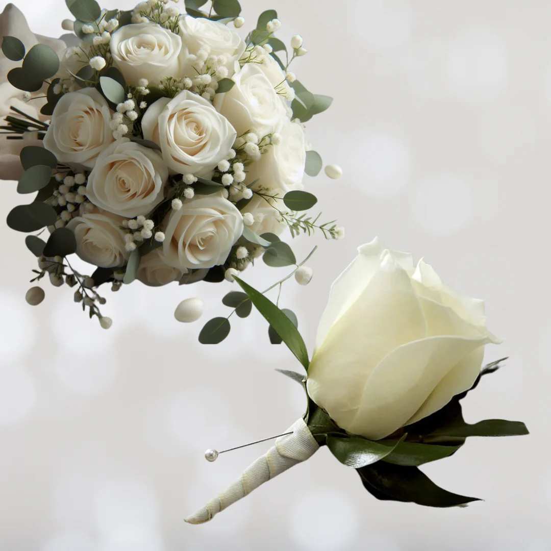 Classic Bridal Bouquet and Boutonniere Package - This classic white bridal bouquet and boutonniere package is a timeless choice for any wedding. This bouquet features a dozen white roses for the bridal bouquet and a matching white boutonniere, wrapped in white satin ribbon. Celebrate this new chapter in your life with this simple, yet elegant bouquet and boutonniere, perfect for any wedding theme or color scheme.  Floral Arrangement Disclaimer: This bridal bouquets includes one dozen (12) fresh roses, complemented by a selection of greens and fillers, providing exceptional value. Each boutonniere features one (1) fresh rose, accompanied by greens and fillers. All arrangements are adorned with ribbons or bows to enhance the overall aesthetic. Please note that the photos provided are for illustrative purposes only and do not reflect the final product. Variations in color, fullness, greenery, and flower availability may occur due to the nature of fresh flowers and seasonal availability. Our dedicated team of designers will ensure you receive fresh, high-quality flowers for your special day. In the event that substitutions need to be made, we will contact you to discuss the changes. We appreciate your understanding and look forward to creating beautiful floral arrangements for your event. 