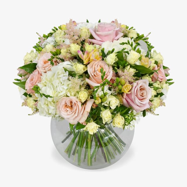 Melody Bouquet - Pastel pink tones and crisp whites make up this beauty. With scented soft pink freesias and stunning roses are balanced out with pure white blooms. This is a classic and well loved colour combination with our florists' favourite seasonal blooms.