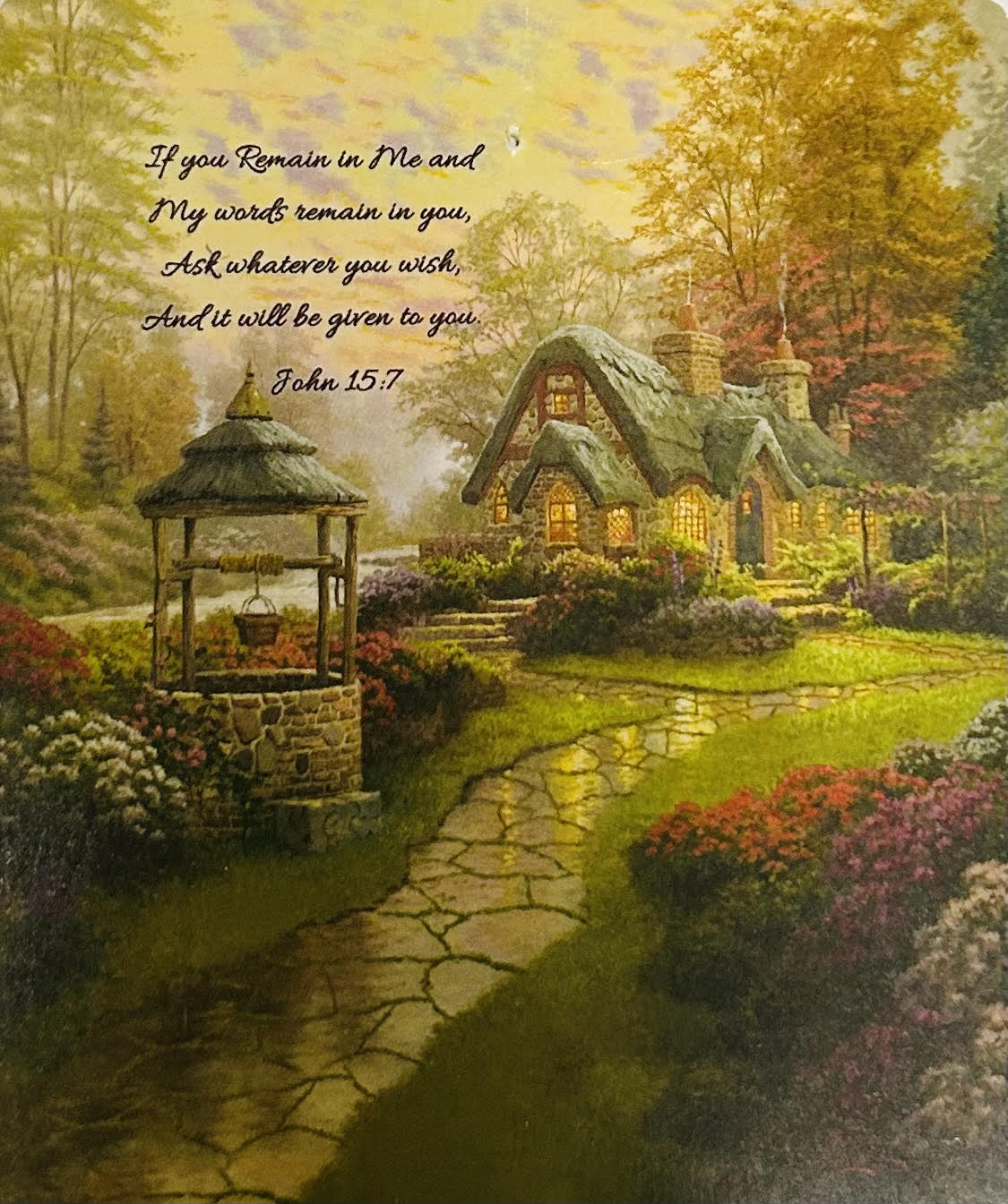 If You Remain in Me John 15:7 Tapestry Throw - A storybook cottage garden scene printed on a cozy 50 x 60 tapestry throw brings a gentle, devotional touch to bedside, living room, or memorial displays - ideal as a sympathy or funeral gift that comforts and consoles. The top of the print features the John 15:7 verse, so the recipient will feel remembered and supported; it also works beautifully as a get well, birthday, or "just because" gift for someone who treasures faith-filled decor.  Soft golds, muted pinks, greens and warm neutrals create a calm, reflective palette reminiscent of an autumn garden path and a small well beside a warmly lit cottage. The throw is presented as printed wall art rather than fresh flowers, and pairing it with the optional wire easel gives a simple, respectful way to display the scene during services or at home. The easel is available as an upgrade for presentation.  Size: 50 x 60. To add the easel for standing display choose the Deluxe option; easel sold separately.
