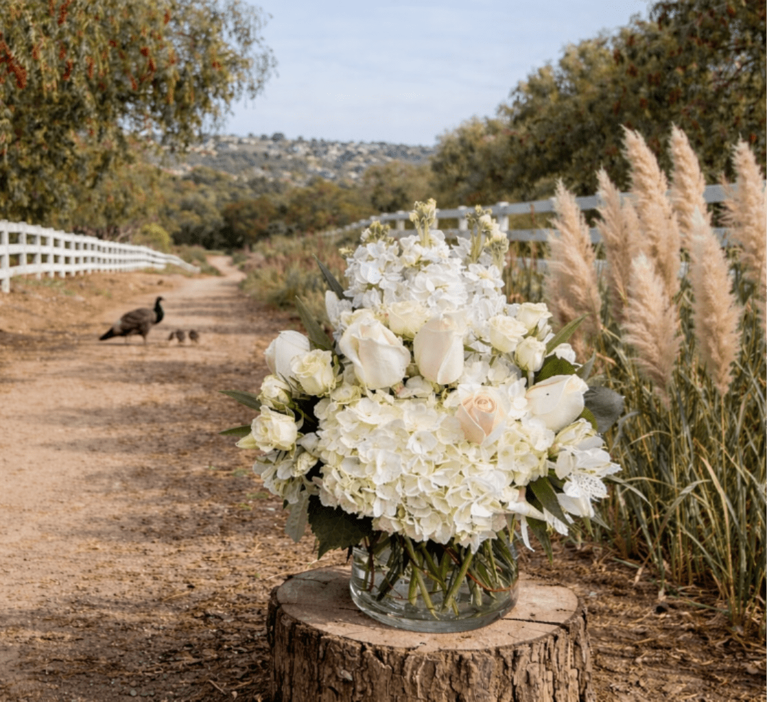 Simply Chic - Simply Chic is designed in clear glass cylinder vase. The Flowers included in this arrangement are  Roses, Spray roses, Hydrangea, Tulips, Stock, and Alstromeria 