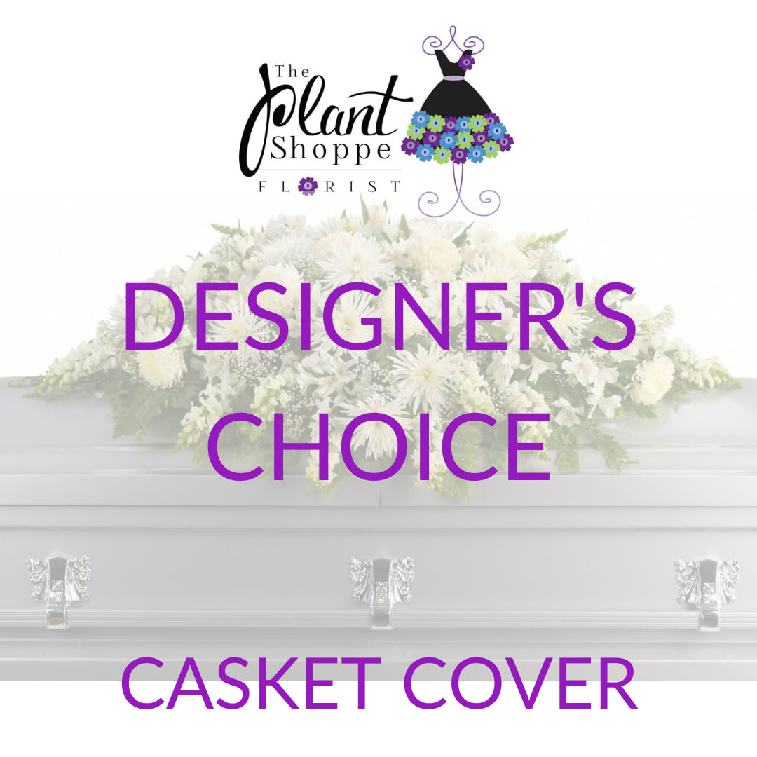 White casket cover with a large floral spray and purple text.