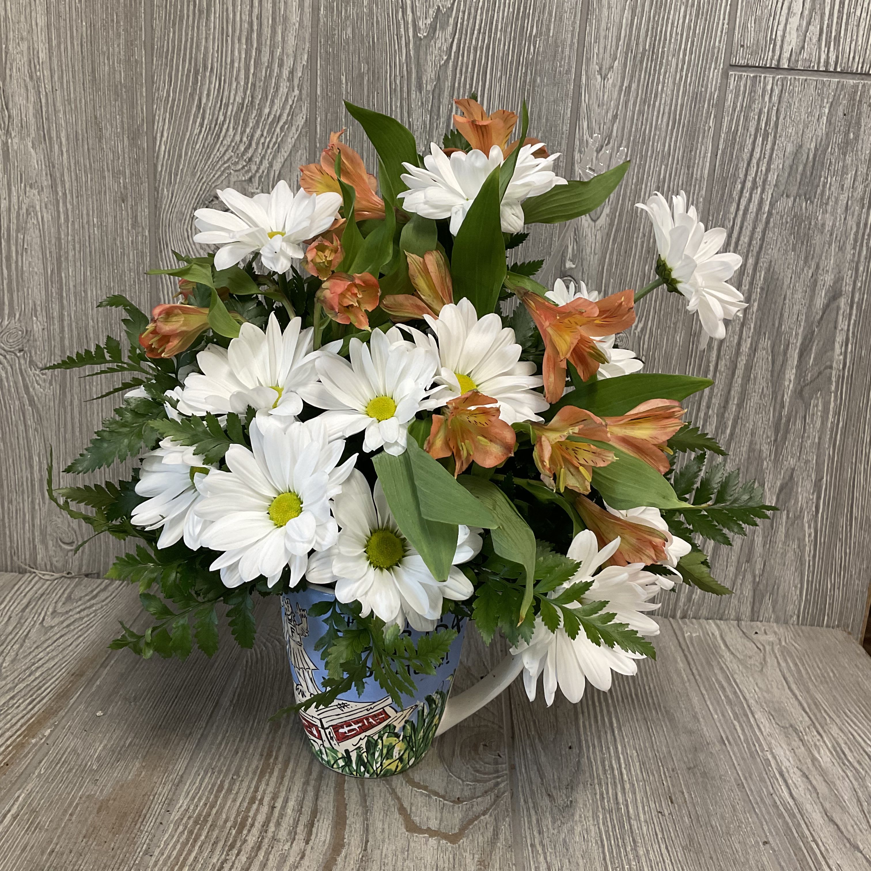 Artwork Daisy Gator Mug - An arrangement of fresh daisies in a keepsake ceramic Gators mug! Flowers and colors may vary. 