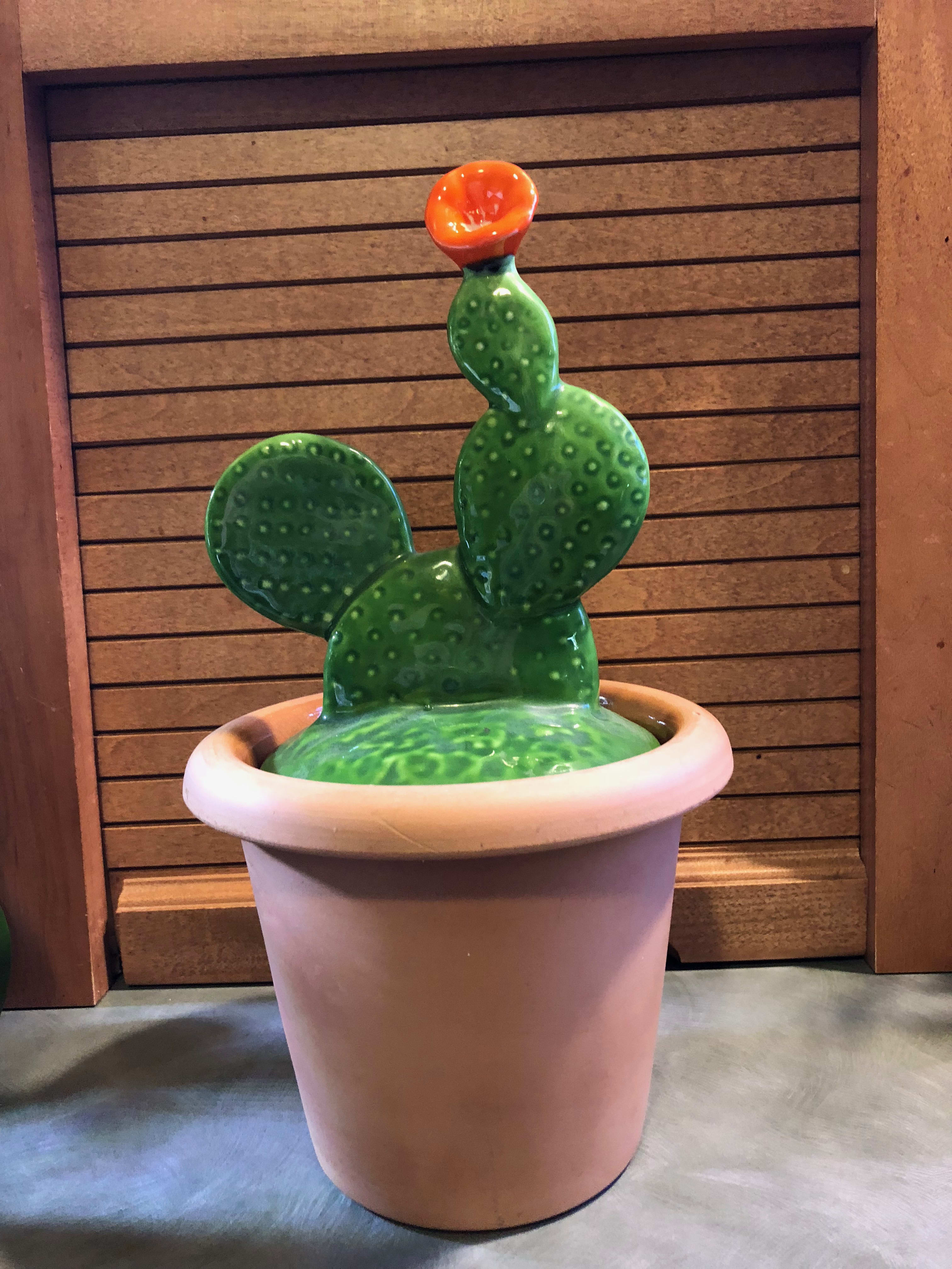 Ceramic cactus sculpture in a large pot