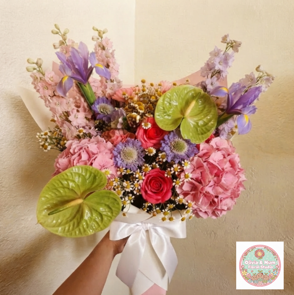 Premium Confetti Blast - Exciting, diverse, and full of life—Confetti Blast is a floral explosion of color and texture. The mix of scabiosa, ranunculus, and feverfew creates a festive visual experience that is truly a party in a bouquet.  This seasonal bouquet features:  Lavender Scabiosa  Hot Pink Ranunculus  Petite White Feverfew  Pink Hydrangea  Pink Larkspur  Green Anthurium  Garden Greens  Presentation: Expertly wrapped in our signature textured paper and tied with satin ribbon. Prefer a vase? Add one to your cart to complete the look.  Personal Touch: We’ll include a custom card message with every order. You’ll be able to write your message at checkout.  Please Note: All flowers are subject to seasonal availability. If a specific bloom isn’t available, our designers will thoughtfully substitute with flowers in a similar shape, style, and color.  Standard size shown. Vase upgrade is optional.   Floral Care Guide  Your arrangement arrives in our signature "double wrap" and is nestled in a protective box. While the stems are secured with a wet wrap for transit they are ready for a full drink!   Unpack: Gently lift the bouquet from the box. Remove the plastic bag and wet towel from the stems. Trim &amp; Hydrate: Trim 1/2" off stems at an angle and place in a clean vase with cool water. Refreshed: Change water daily for a long-lasting bloom.  