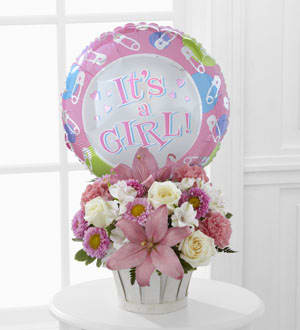 The FTD Girls Are Great! Bouquet - The FTD Girls Are Great! Bouquet is blooming with sweet love to congratulate the new family on their darling baby girl! White roses, white Peruvian lilies, pink carnations, pink matsumoto asters, pink Asiatic lilies and lush greens are beautifully arranged in a round whitewash woodchip basket. Presented with a Mylar balloon declaring, "It's a Girl!" this incredible flower arrangement is the perfect welcome for their new addition.