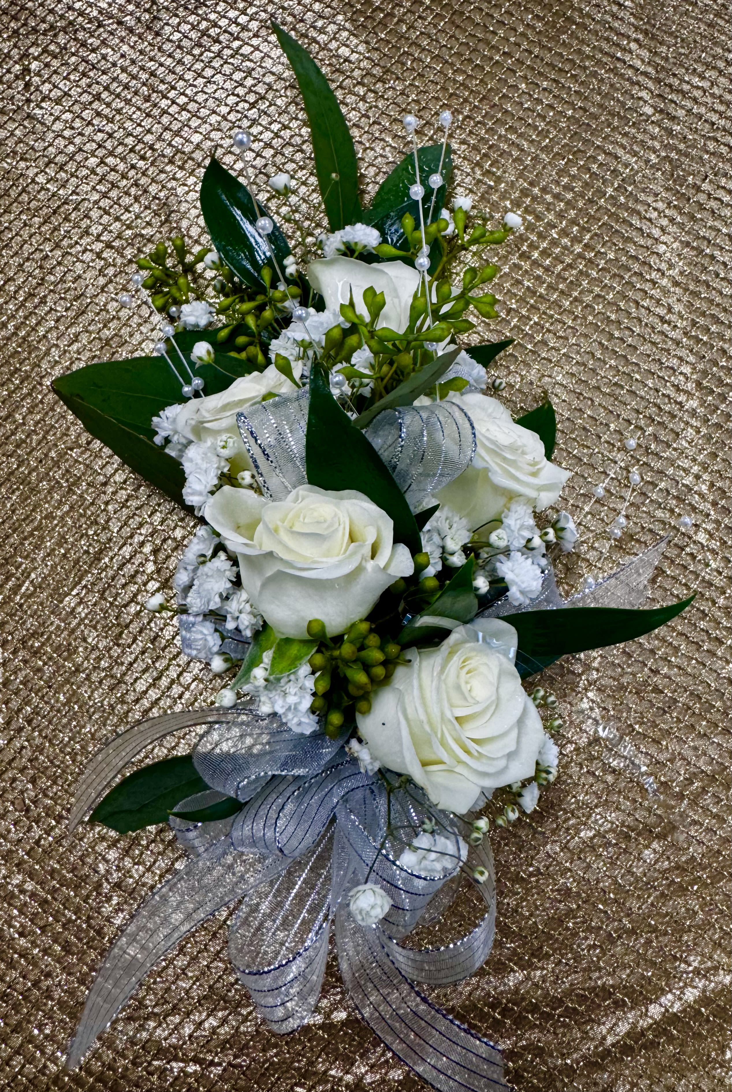 White rose corsage with silver ribbon and pearl accents