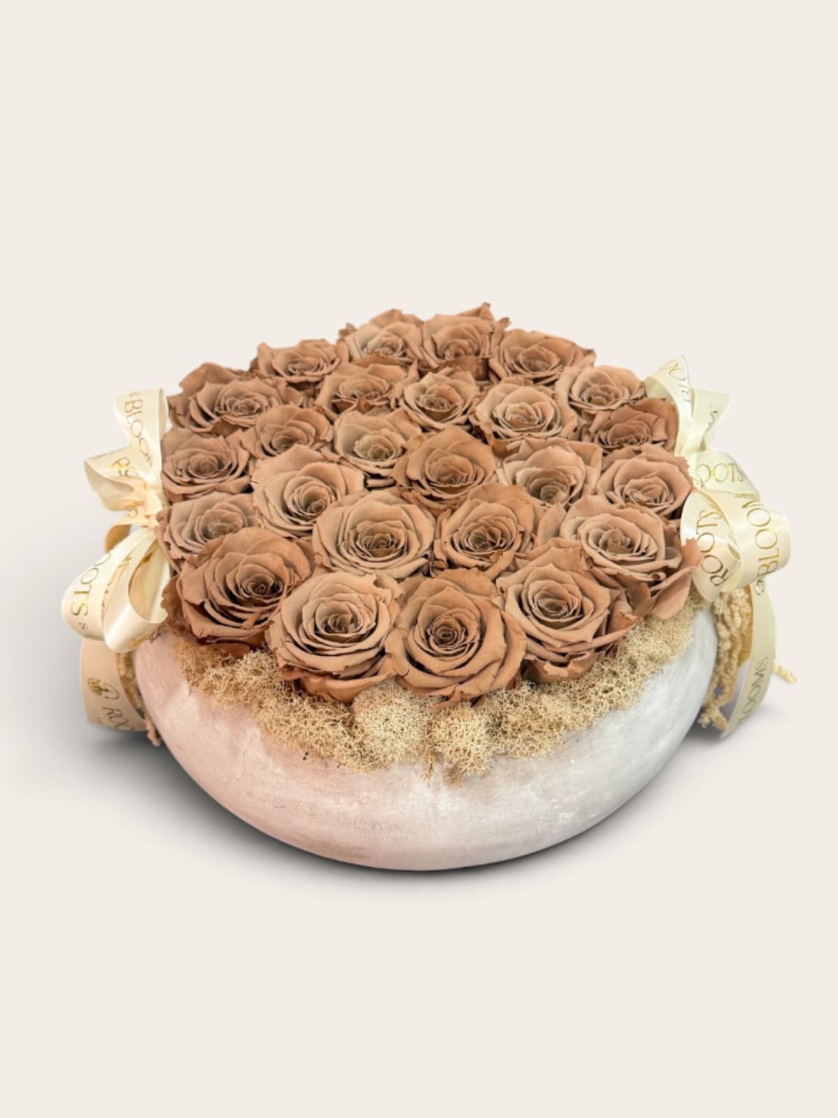 Eternal Mocha - Eternal mocha features premium preserved roses in a rich, warm, neutral hue, hand, arranged in an elegant decorative vessel and finish with our signature Roots and blooms ribbon. Designed to maintain their beauty for up to three years with proper care, this real preserved roses require no water or maintenance. -a timeless statement piece made to be enjoyed long after it is received.