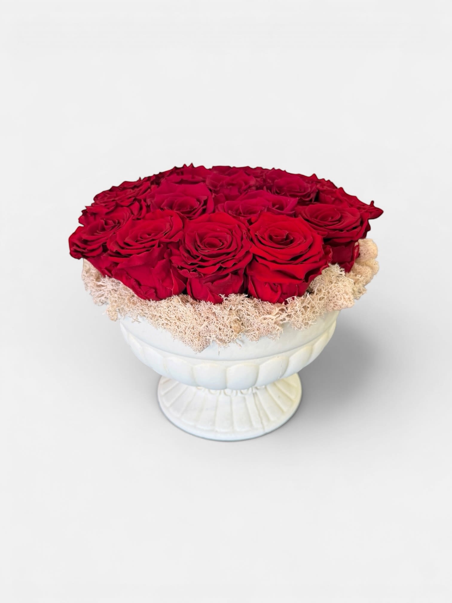 Eternal Scarlet Roses - A luxurious arrangement of premium preserved red roses, beautifully set in the classic pedestal vessel and designed to last for years. Rich in color and timeless and style, this piece symbolizes everything love and elegance. -no maintenance required