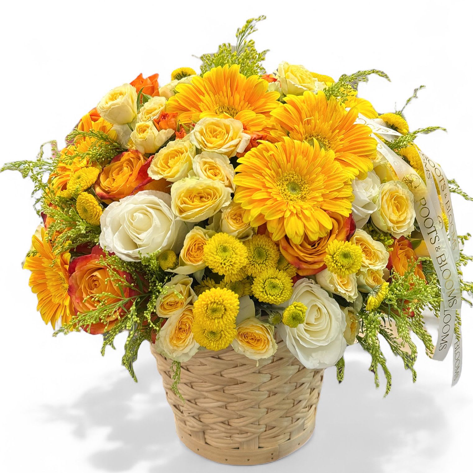 Basket arrangement of yellow, orange, and white roses with gerbera daisies