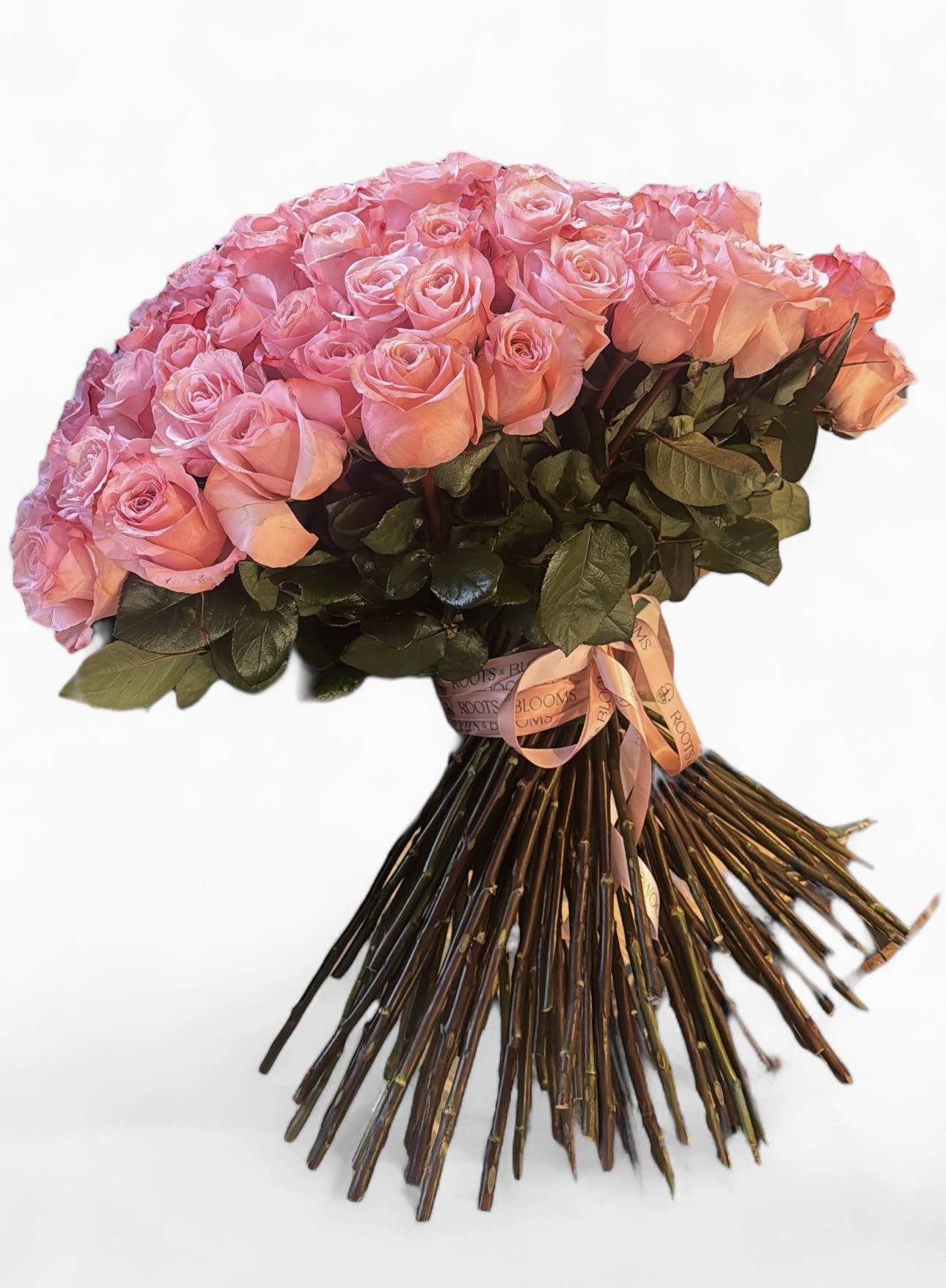 Large bouquet of pink roses tied with a ribbon