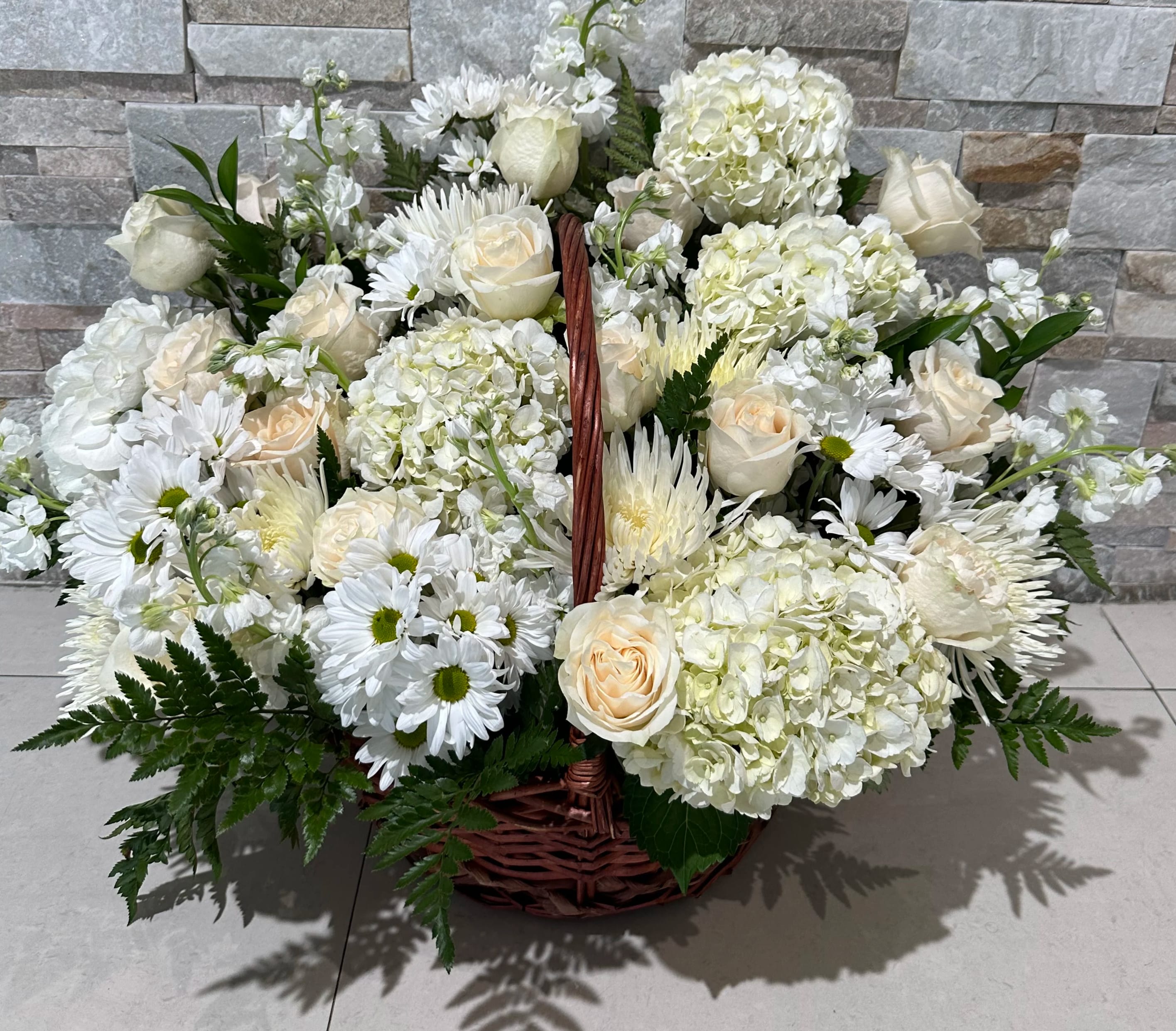White Dreams - Beautiful basket with flowers such as hydrangeas, roses, stocks and daisies. 