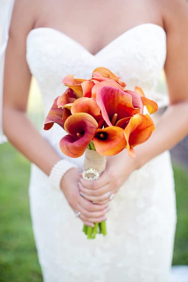 Bridal orange bouquet - orange calla lily tie together with a silk ribbon