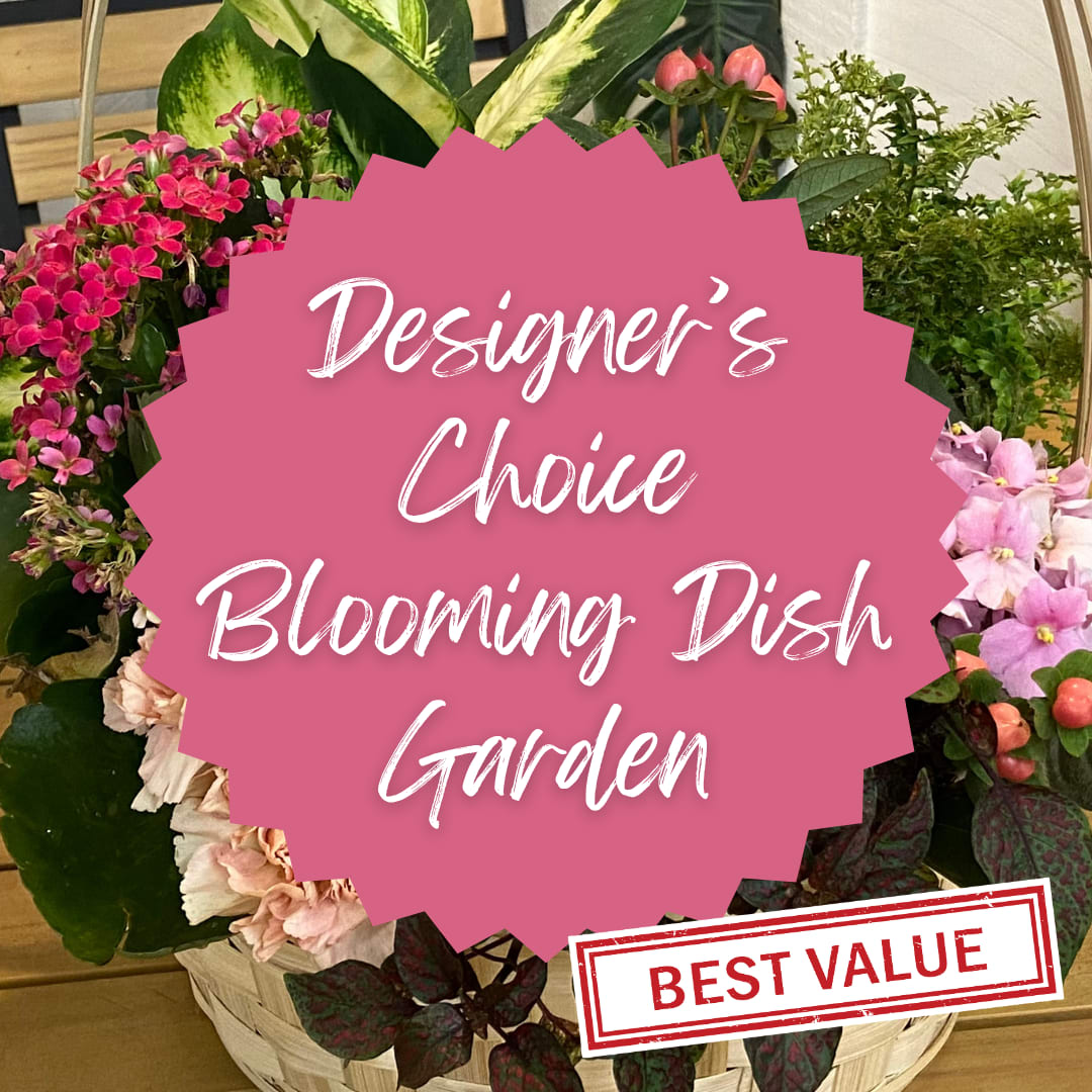 Mixed flower basket with pink and white blooms and a pink label