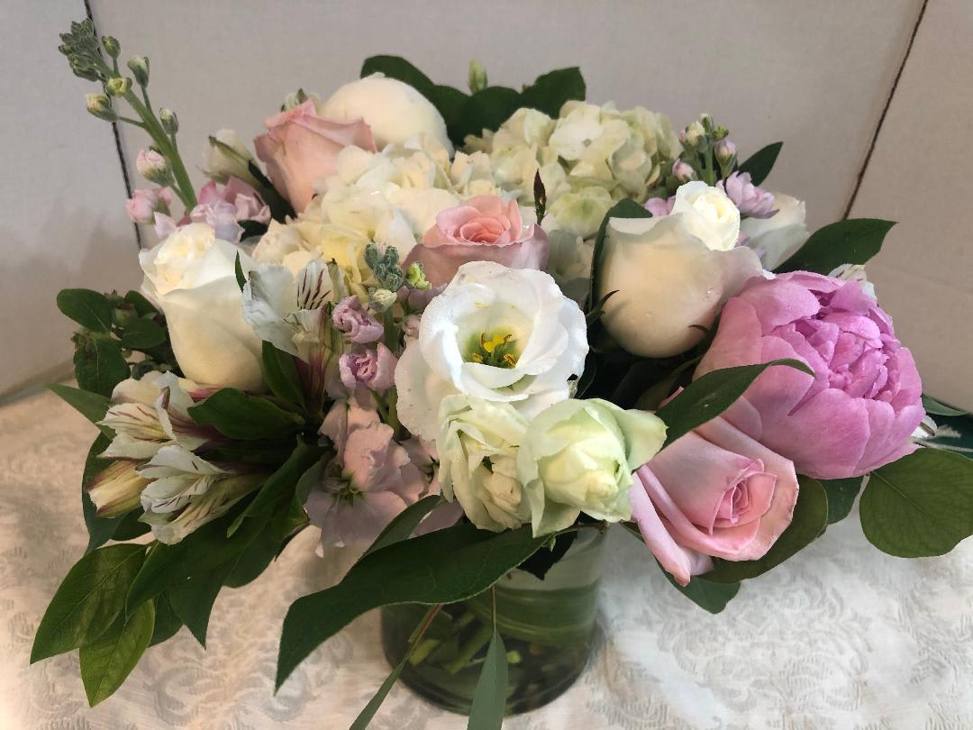 Pink and white mixed bouquet in a glass vase