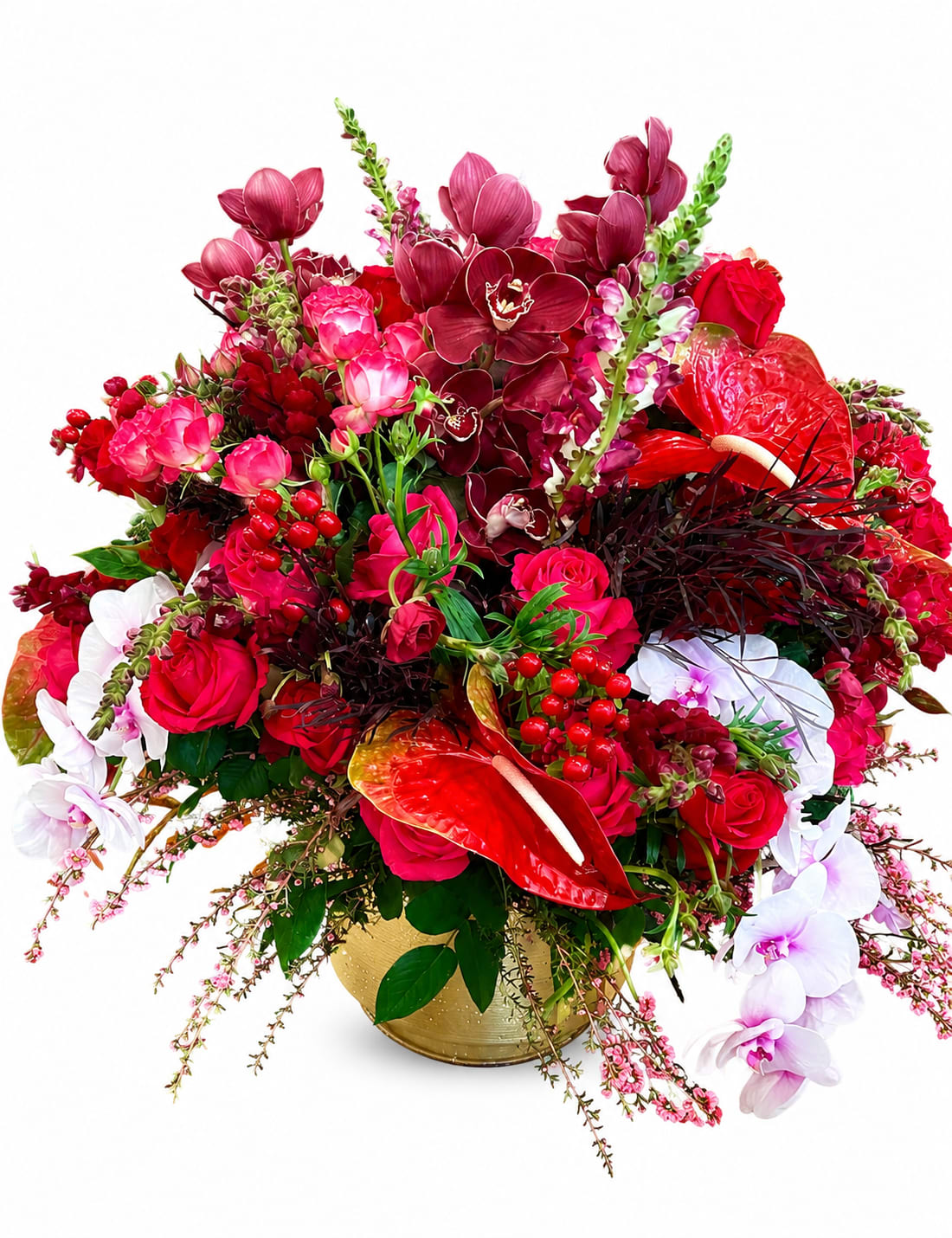  Luxury Blooms for Extraordinary Moments ( preorder only)  - A lush, high-impact arrangement crafted for love and celebration-this preorder-only flower arrangement brings together roses, orchids, anthurium, snapdragon spikes and more in a bold red, pink, white and purple palette. Built tall and densely packed in a gleaming gold vase, it reads as a dramatic romantic statement perfect for anniversaries, milestone birthdays, or to say thank you in a way that makes someone feel genuinely seen.  Visually sumptuous, the design pairs hot-pink roses and red anthuriums with white and purple orchid sprays and tall, snapdragon-like spikes for height and movement; glossy petals, deep burgundy accents, and bright berry-like textures add contrast and depth. Trailing filler around the base softens the silhouette while keeping the composition full and celebratory. The gold vase anchors the arrangement and makes it ready to display.  Made to mark extraordinary moments, this bouquet suits a partner, parent, or close friend when you want to convey deep affection or celebrate a big achievement. Preorder only-please allow lead time for production; the dense, layered construction benefits from careful handling and fresh water changes to keep blooms looking luxurious.