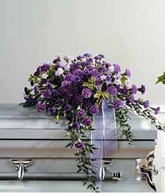 SF35-11 - John Henry Sympathy - a large way to show your condolences to much more than a friend to someone who grew to be part your family. This Grande purple spray shows love and honor with its deep colors and tall flowers.  