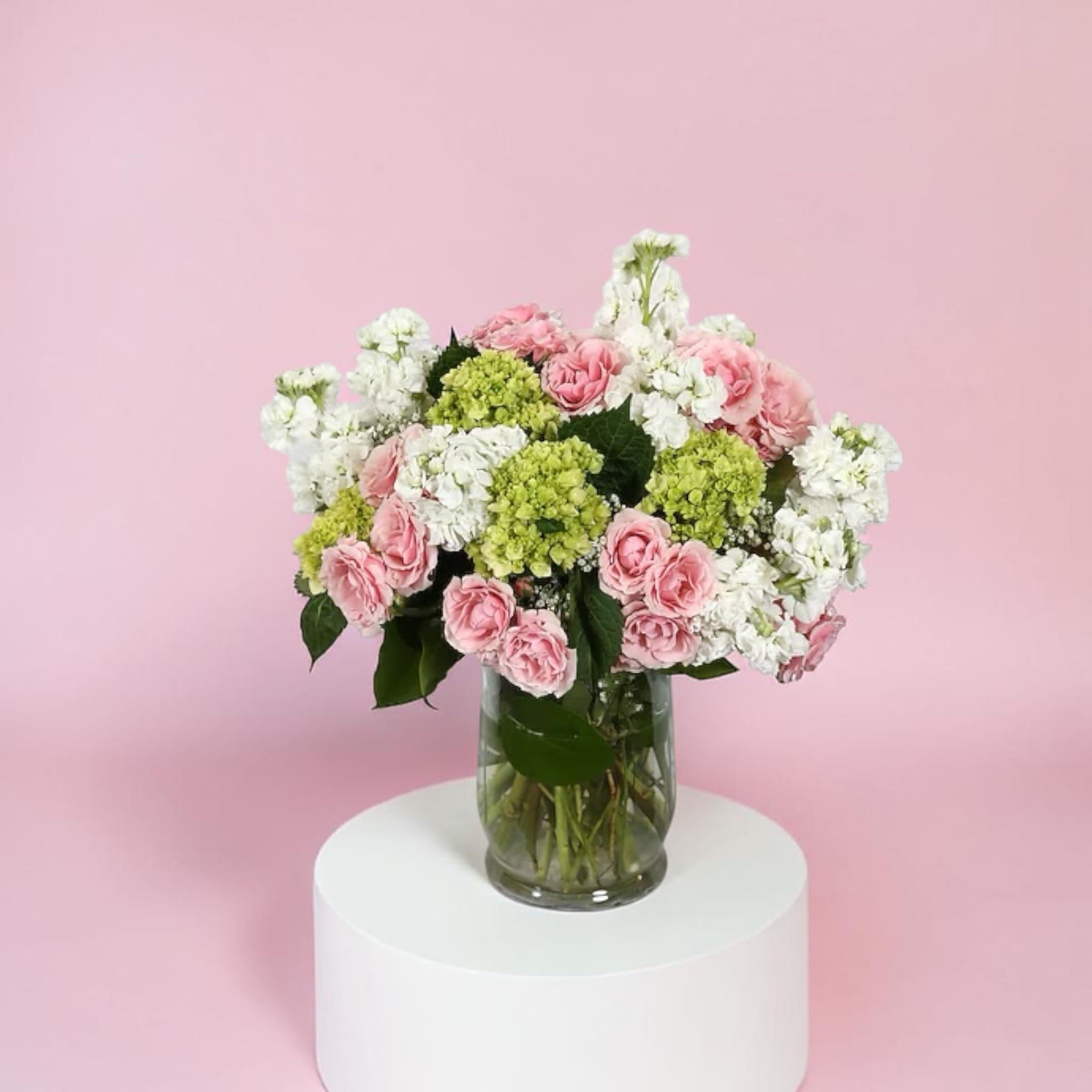 Smile in Flowers - Spray roses (we choose the color), hydrangea, and stock. Classic and elegant. 