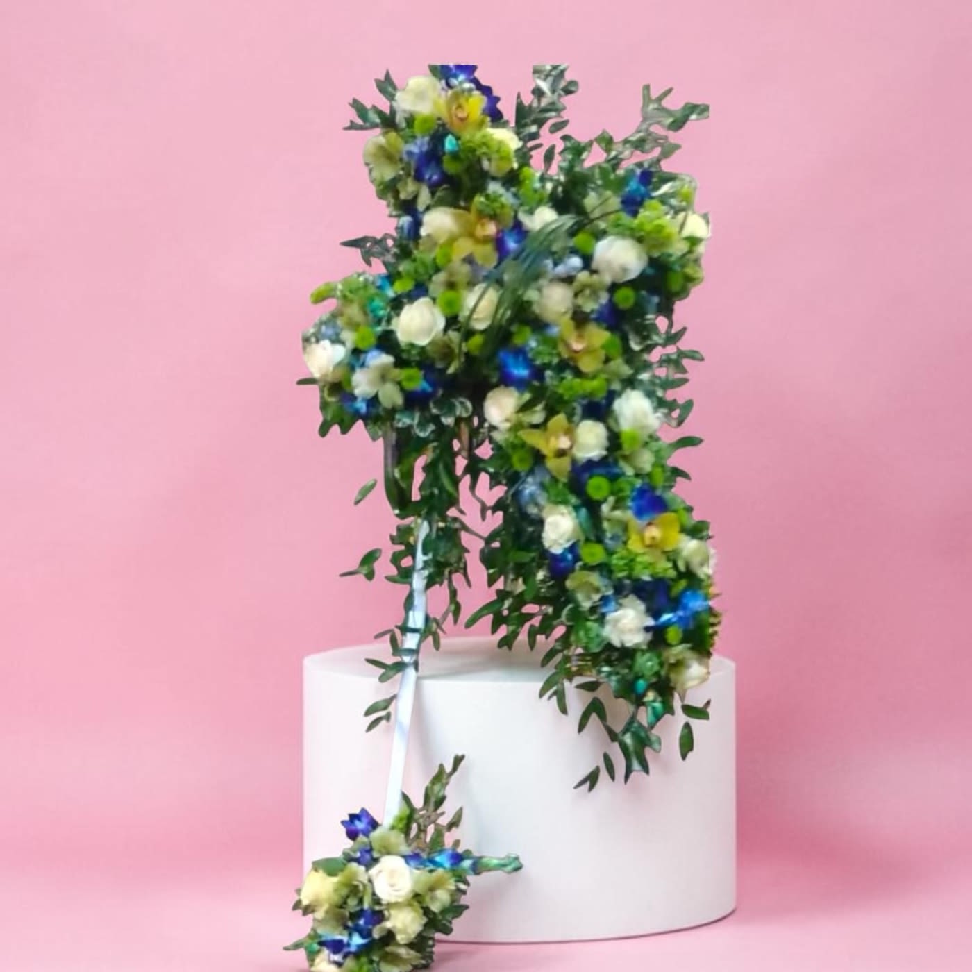 Standing Cross of Orchids and Roses - This is one of the most amazing standing cross pieces on our website. It is even more impressive in person. Amanda's favorite cross. It is a stand out piece at a funeral service.