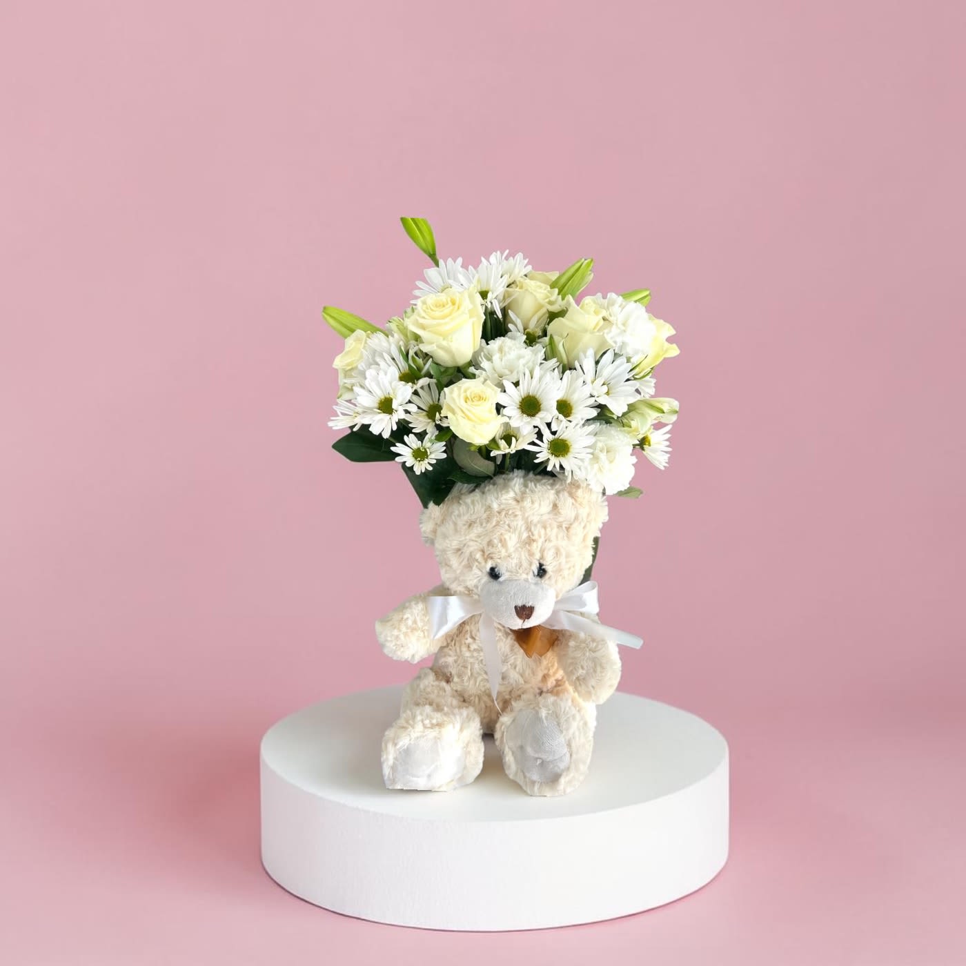 Teddy Combo by Amanda - Flowers and fun vase! Lovely white flowers coupled with a plush bear, dog, or cat. Cheer up anyone with this arrangement. 