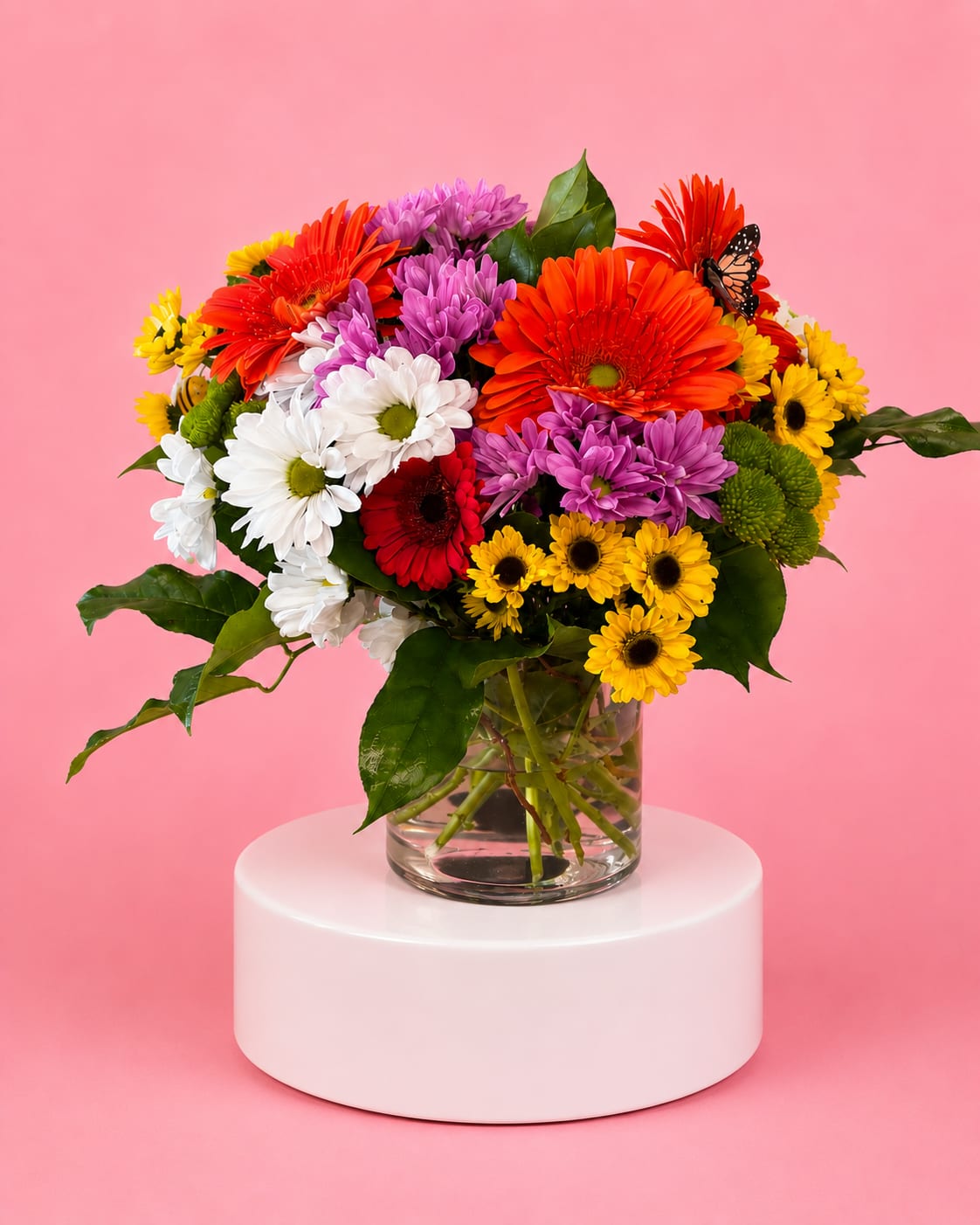 Colorful bouquet of daisies in a clear glass vase