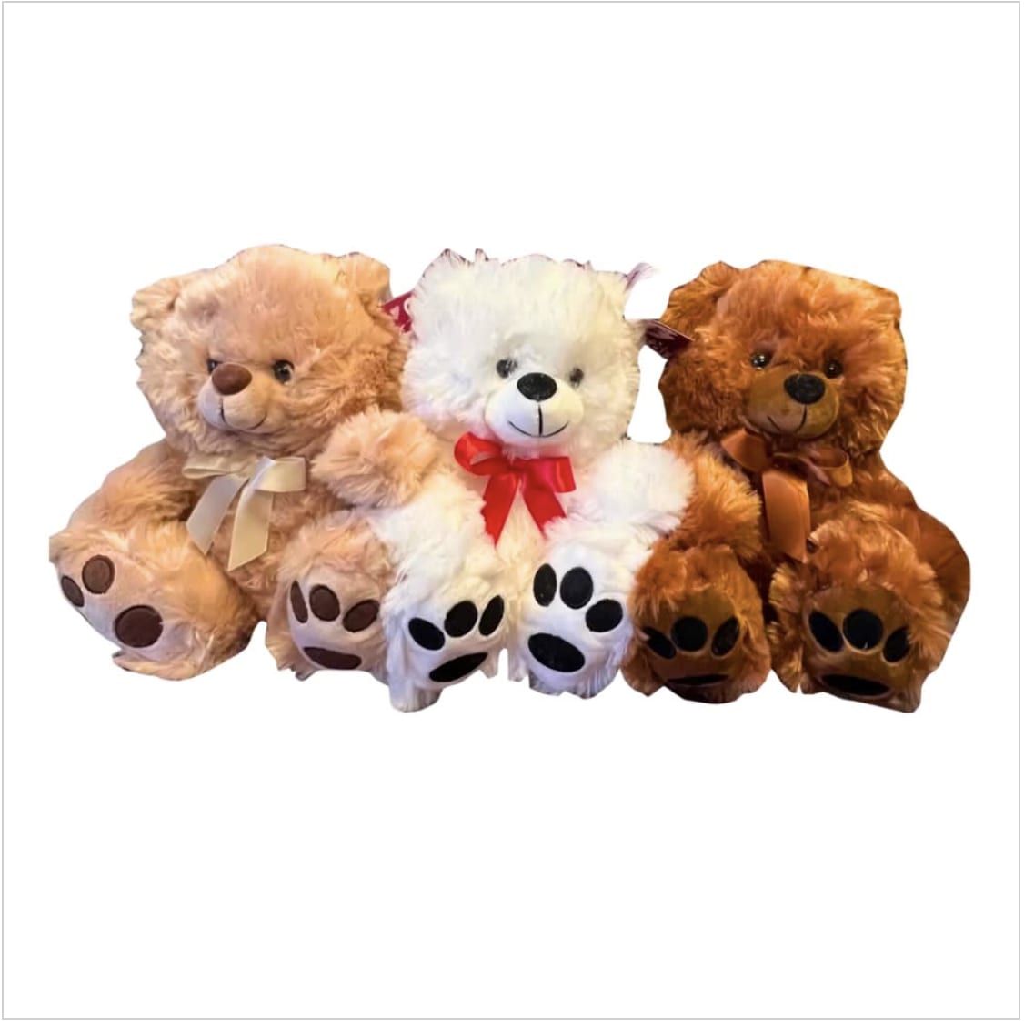 Three teddy bears with ribbon bows sitting together