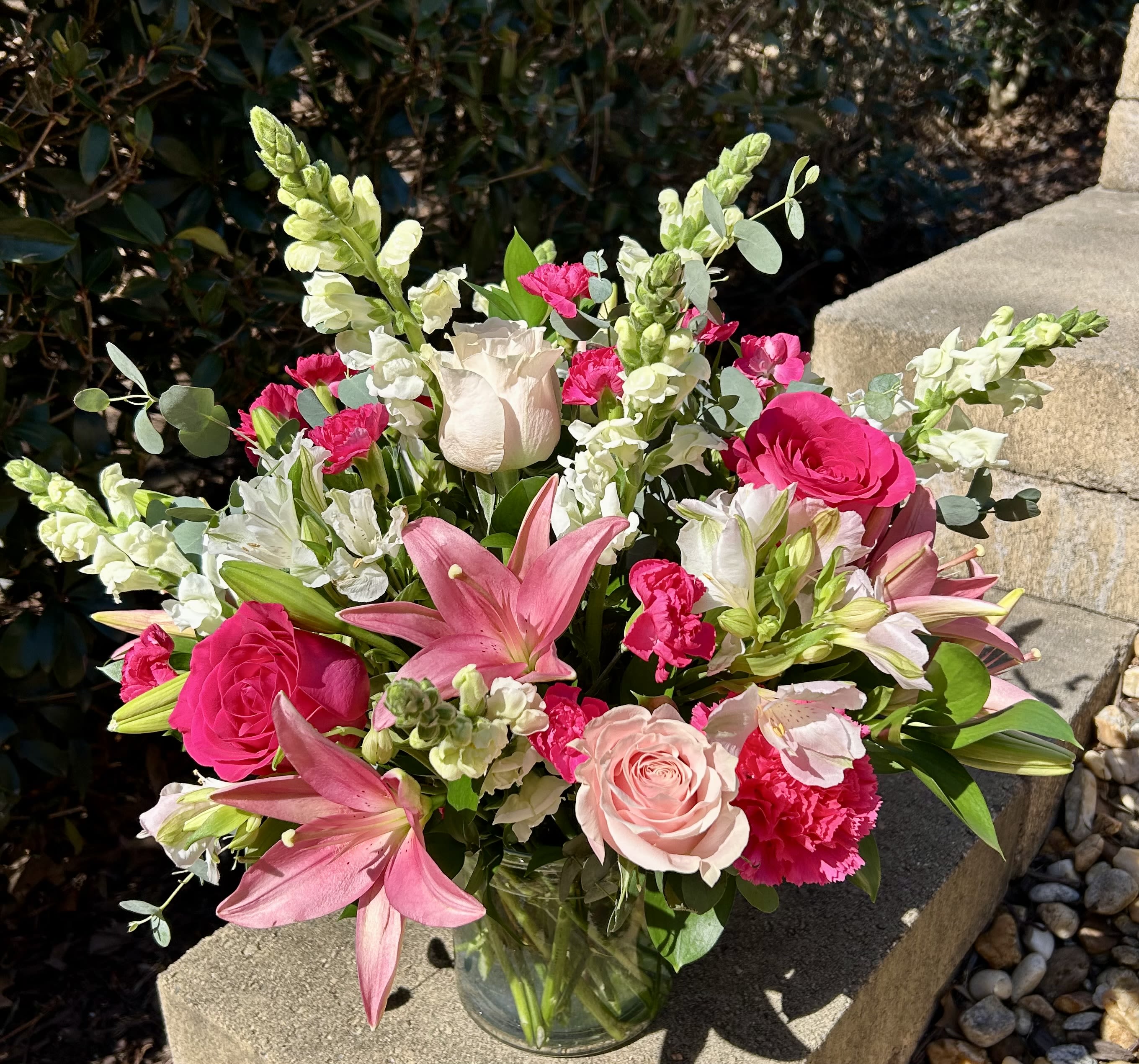 Bouquet of pink and white flowers in a glass vase