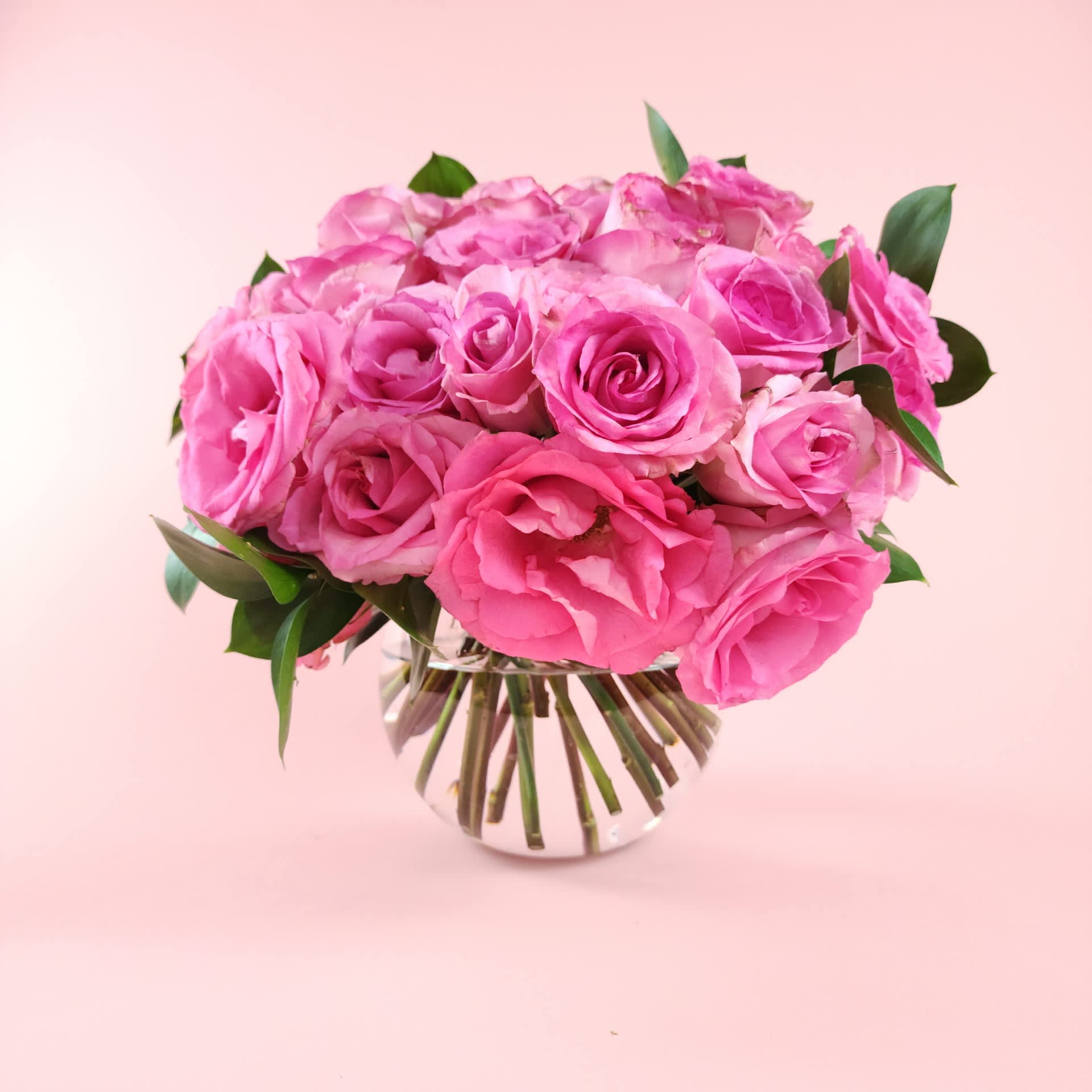 Pink rose bouquet in a clear glass vase