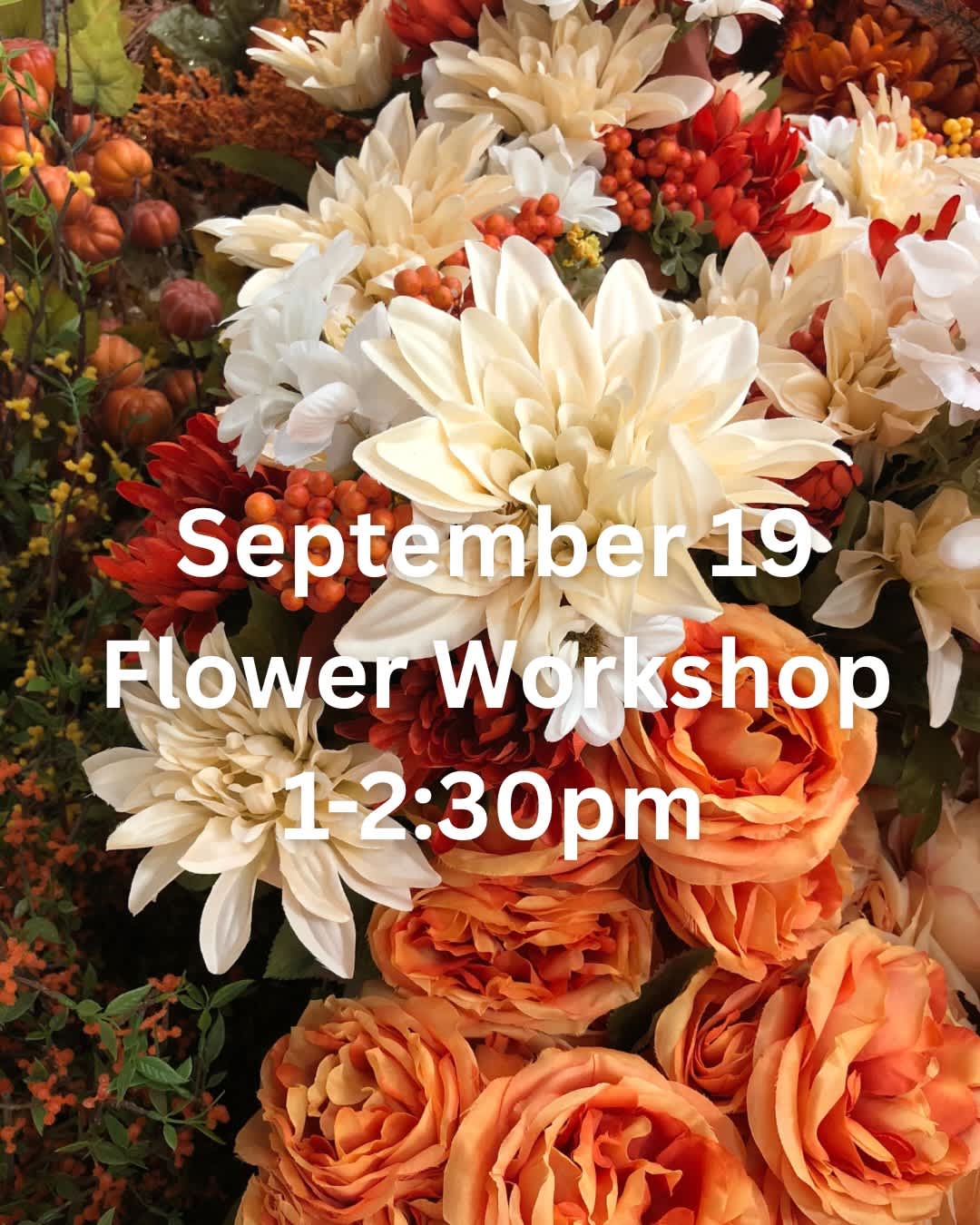 Autumn floral display with cream, orange, and red blooms and workshop text
