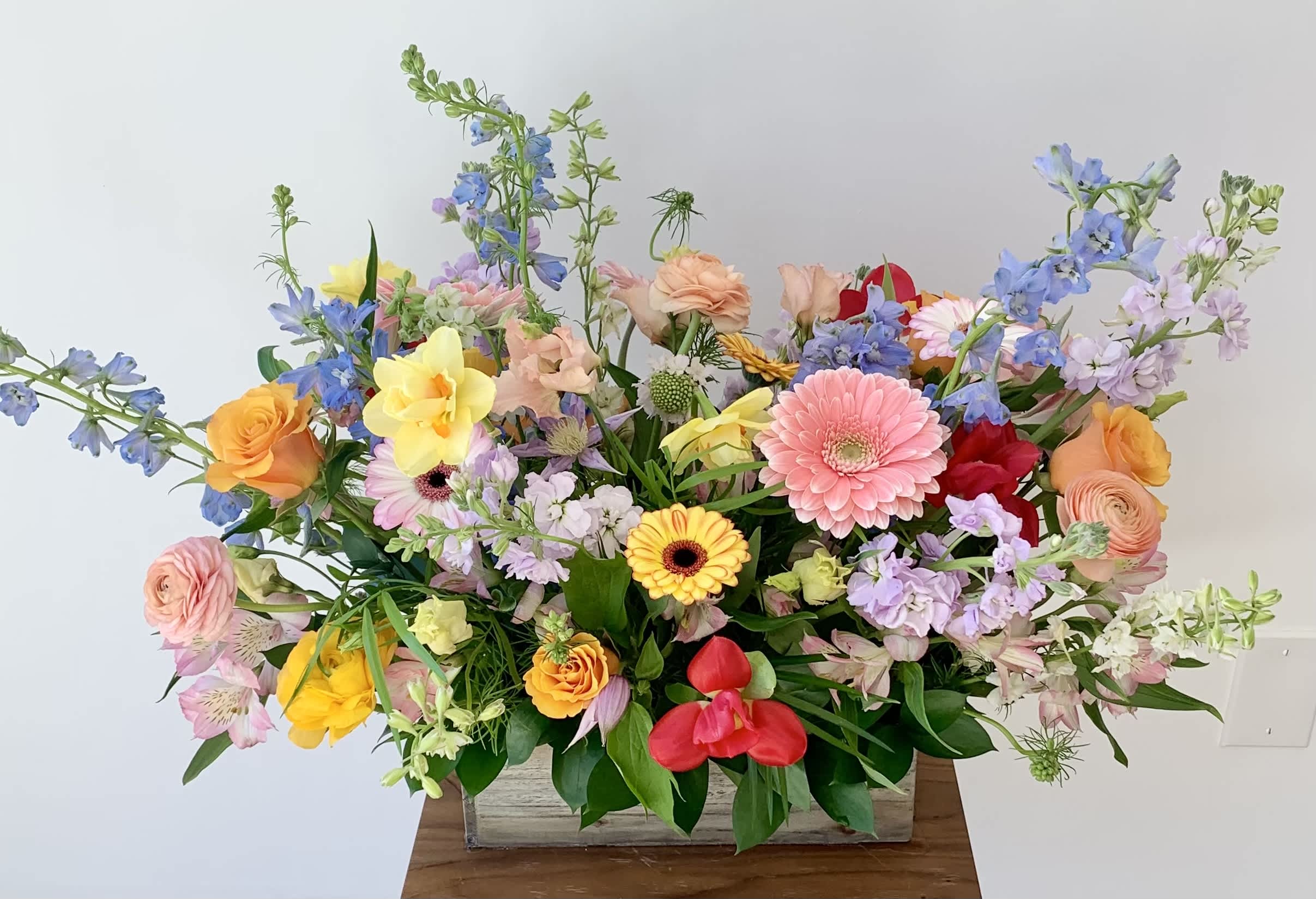 Step Into Garden - Lush flower arrangement in a 12 inch long wooden planter box with seasonal and premium flowers created in a garden style. A rich variety of flowers and colors that reflect the season and also availability of locally grown flowers. Selection of flowers vary but rest assured that Michaela, the designer, always carefully selects the most fresh flowers and creates beautiful arrangements. 