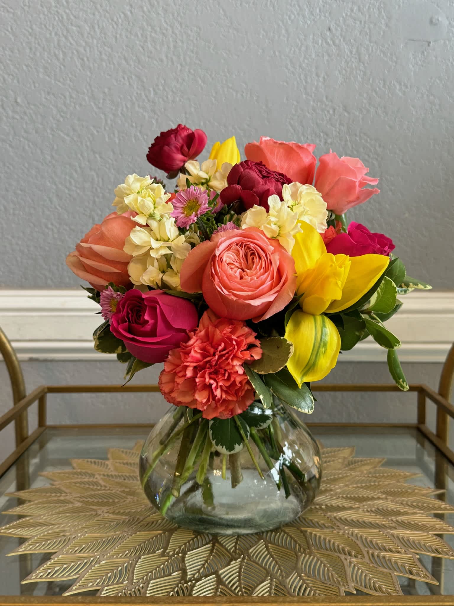 Colorful mixed bouquet in a clear glass vase
