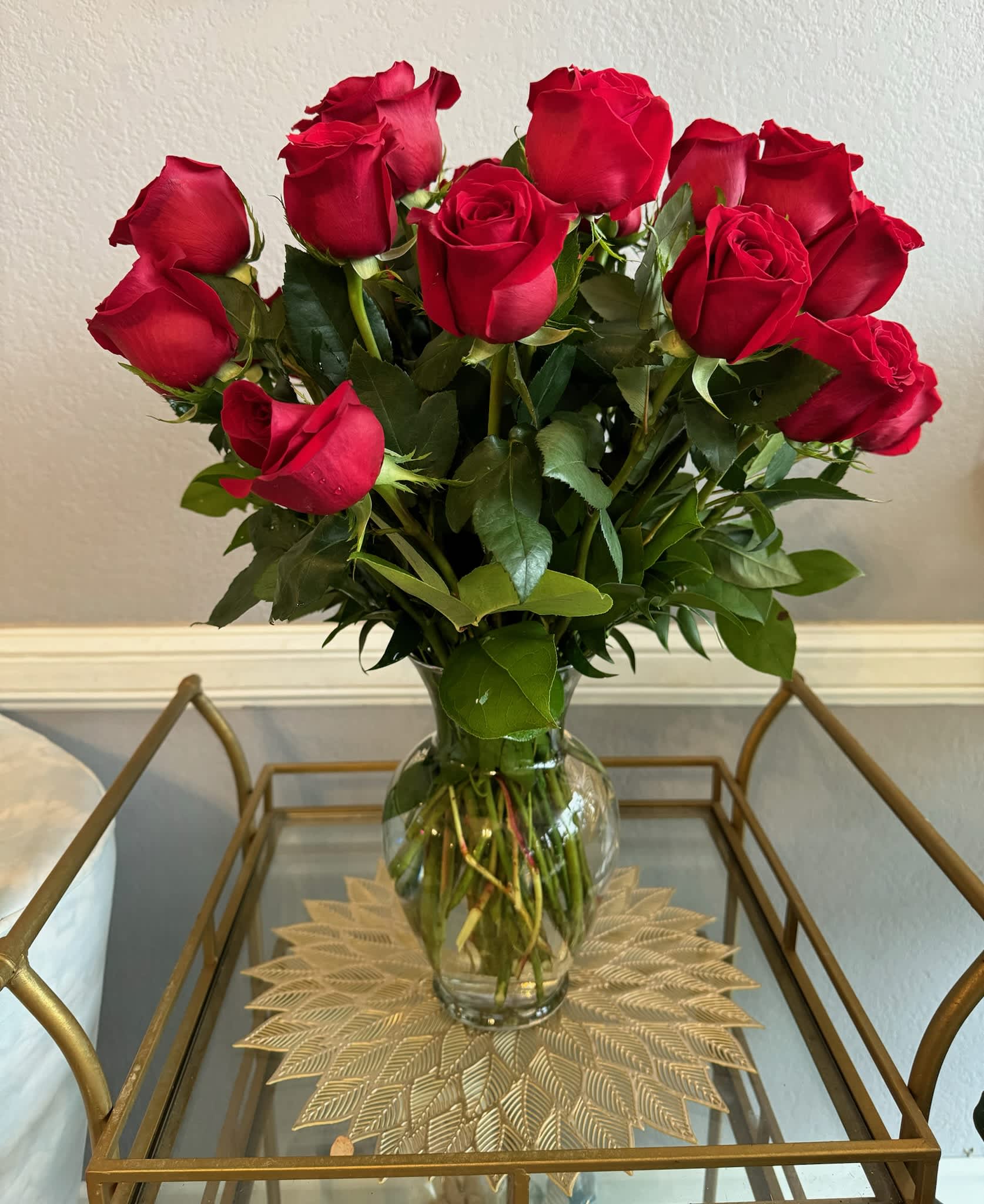 Bouquet of red roses in a clear glass vase