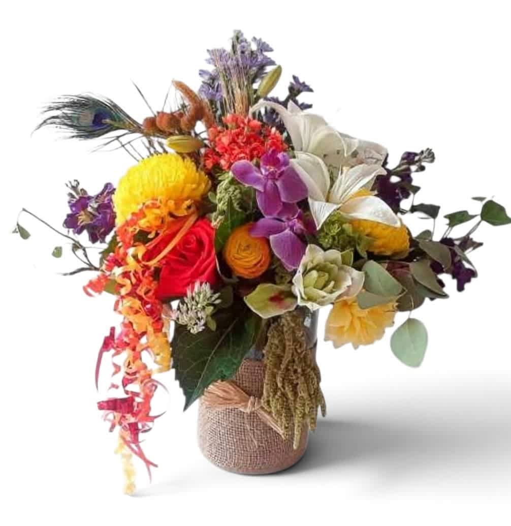Colorful mixed bouquet in a burlap-wrapped vase with peacock feathers