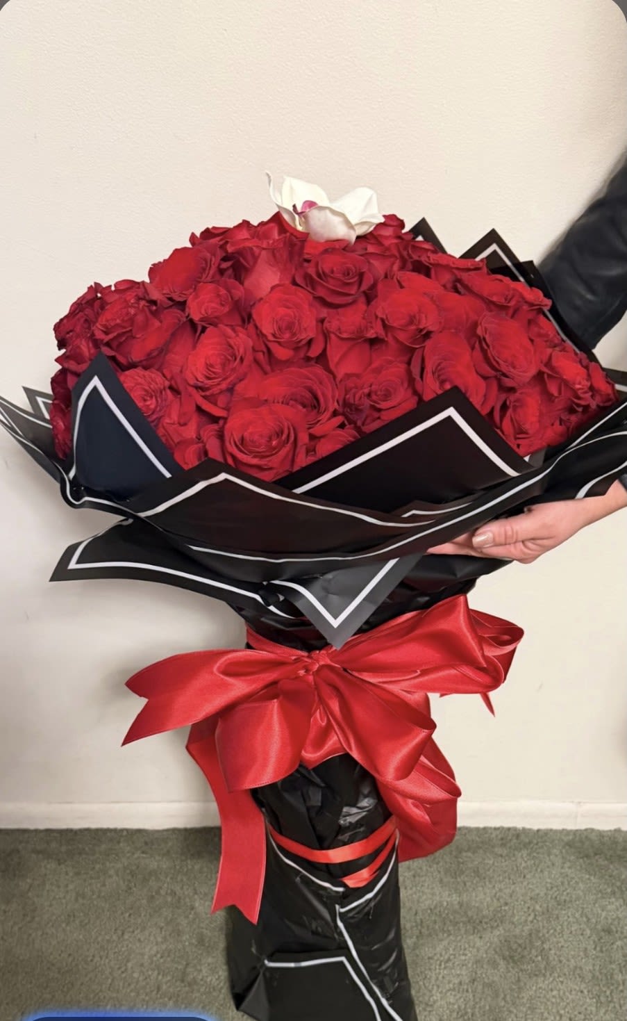The Presidential - A Ramo Buchon or Russian-style bouquet of 72 stems of  roses (6 Dozen), tightly arranged and wrapped in luxurious paper. 