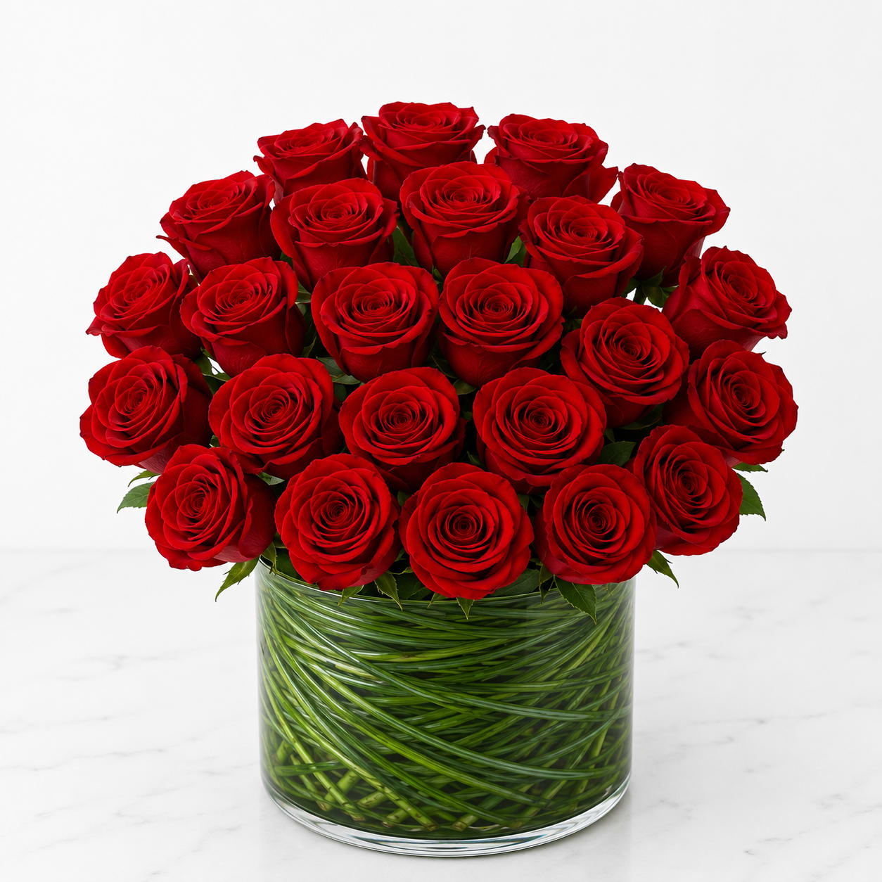 Bouquet of red roses in a clear glass vase