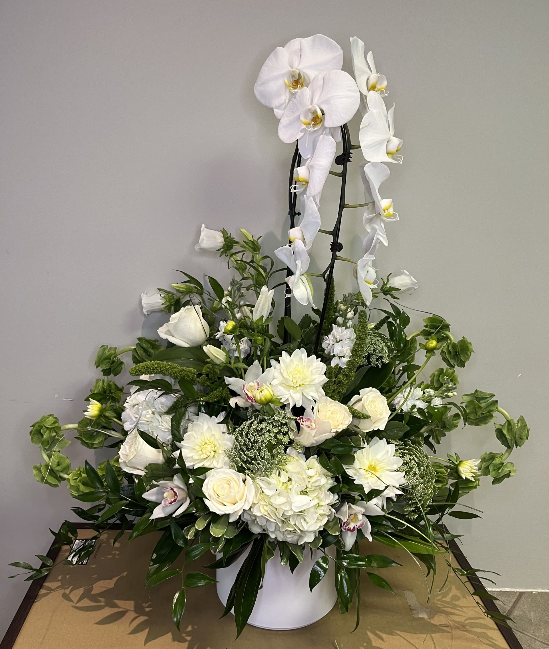 Serenity by Chasing Petals - Quiet strength and comfort radiate from this elegant arrangement to anyone going through a difficult loss. 