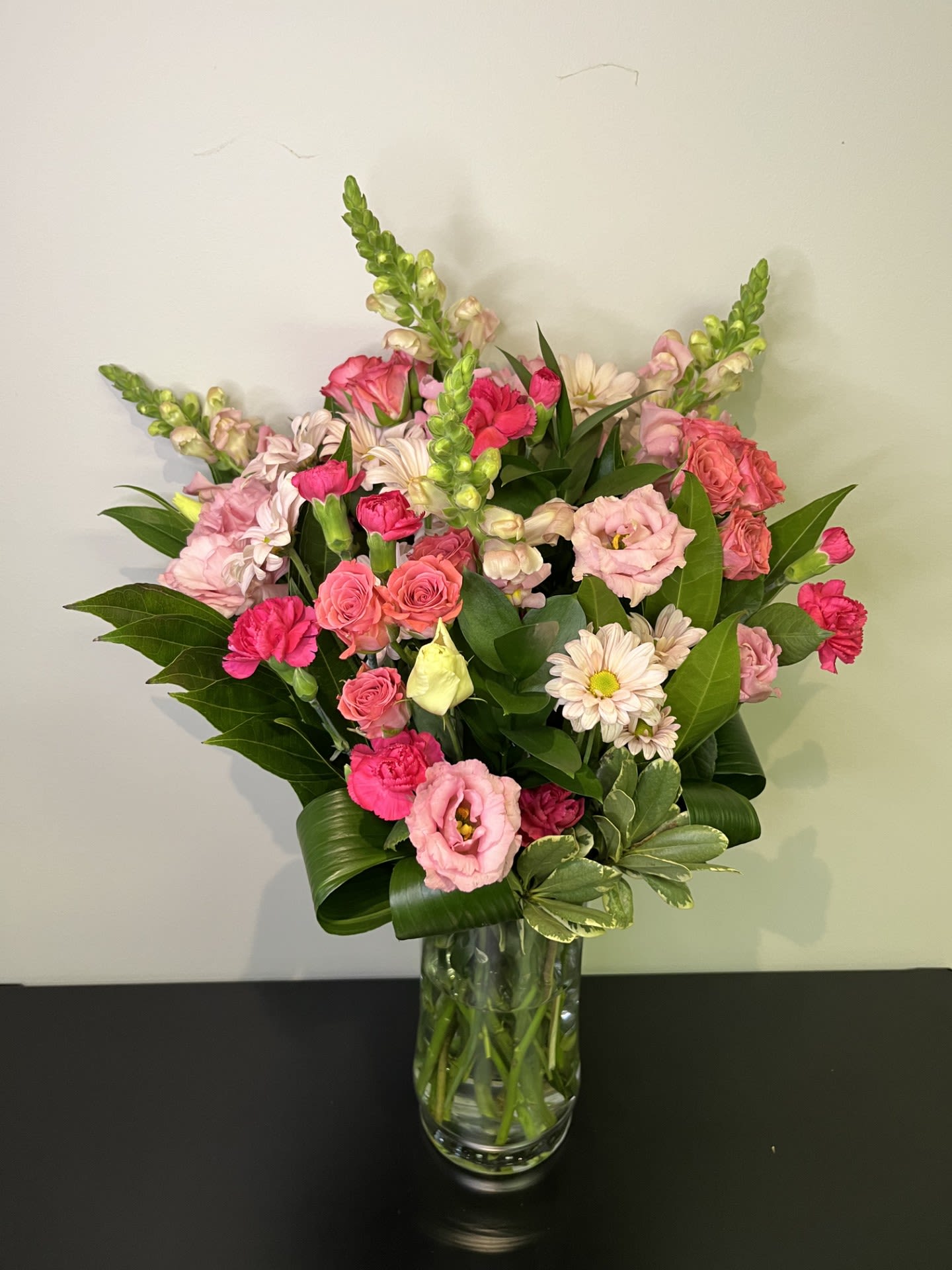 Pink mixed bouquet in a clear glass vase