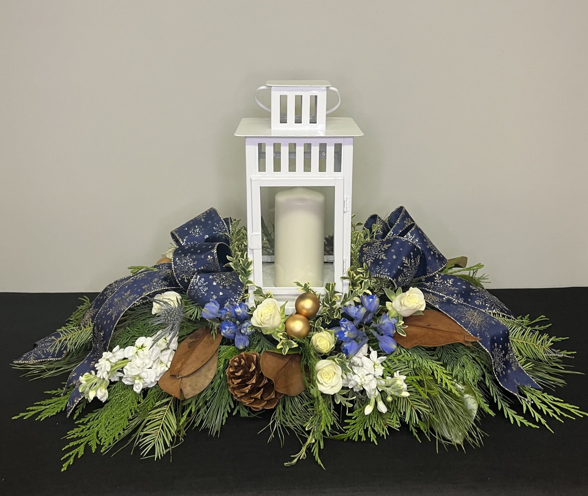 Blue-tiful Night by Chasing Petals - Bring in the warm peace of twilight in the winter with this lantern centerpiece.  Black or white lanterns are available, please call if you would prefer alternate colours.