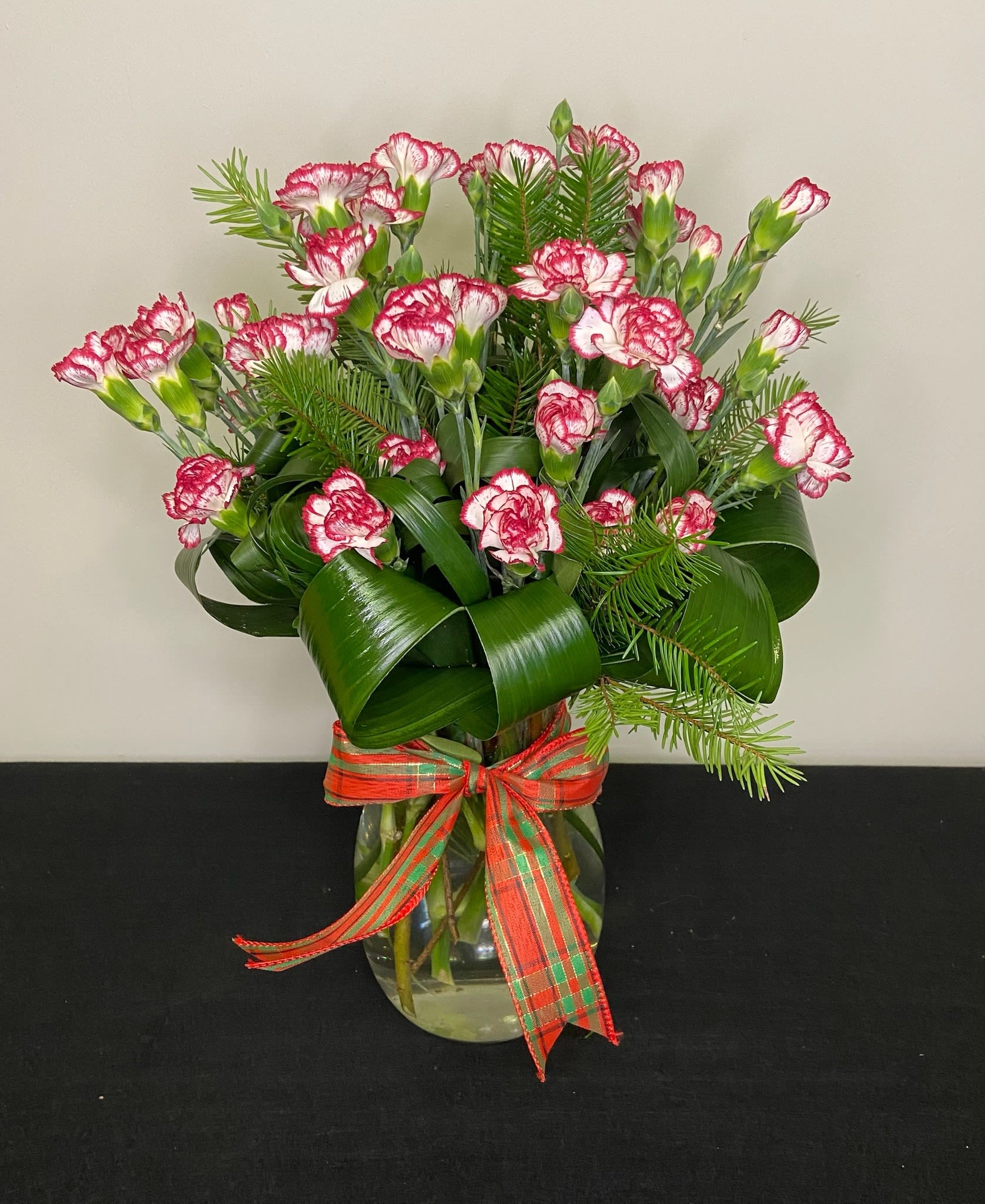 Mint to Be by Chasing Petals - Candy Cane mini carnations arranged in a vase and tied with a festive bow, candy cane lovers unite!   Colour of carnations and bow are adjustable, please call us to confirm any changes!