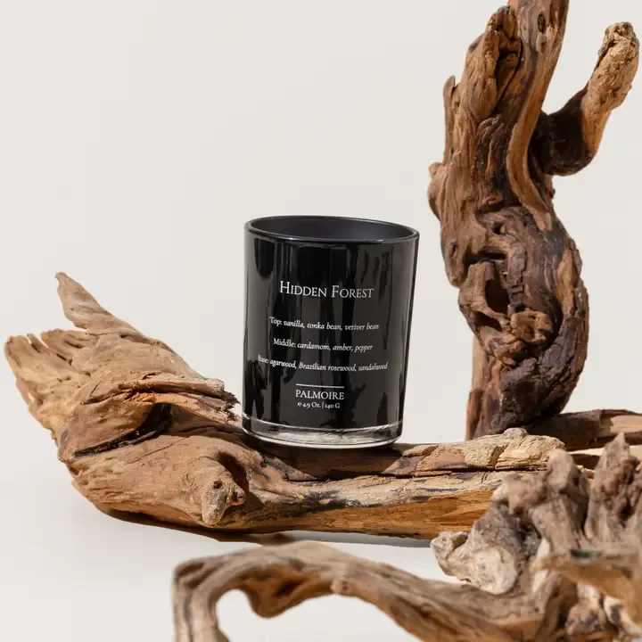Hidden Forest Soy Wax Candle - *Only the 2.3oz has gemstones inside the candle *Our tester has the same size and package as the original product  The touching woody aroma is accompanied by a hint of vanilla freshness, a reminiscence of a wonderful forest retreat. The magical mist of agarwood, Brazilian rosewood and warm sandalwood perfectly captures the subtle coziness by the campfire.  Top Notes: vanilla, tonka bean, vetiver bean Middle Notes: cardamom, amber, pepper Base Notes: agarwood, Brazilian rosewood, sandalwood