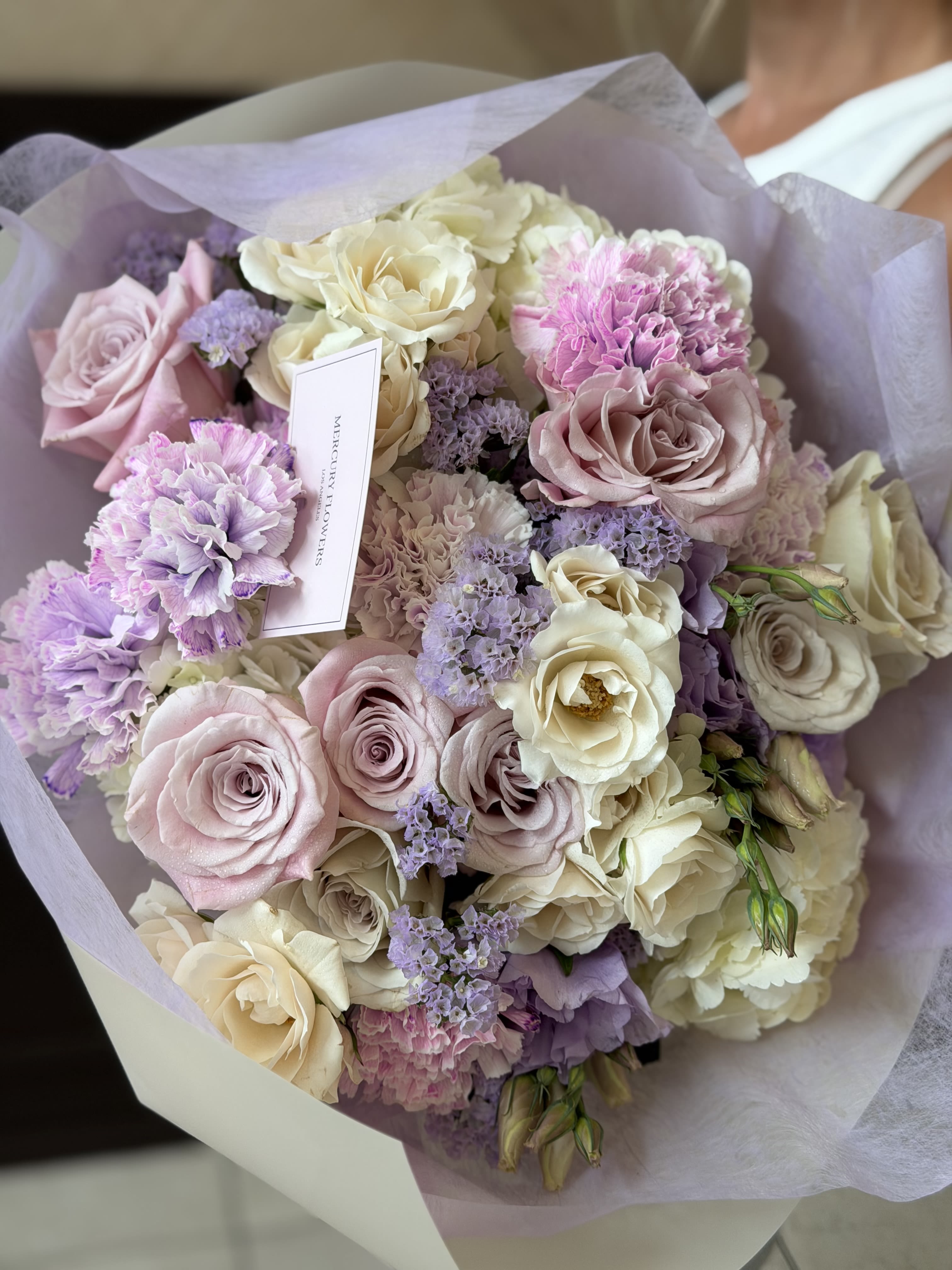  Lavender Blush Bouquet - A dreamy pastel bouquet designed in soft shades of lavender, blush pink, and creamy ivory. Featuring premium roses, delicate carnations, hydrangea, lisianthus, and statice, this arrangement feels airy, romantic, and elegant. Wrapped in soft lavender paper for an extra luxurious touch, it’s perfect for birthdays, celebrations, sweet gestures, or simply making someone smile! Same-day flower delivery available in Los Angeles