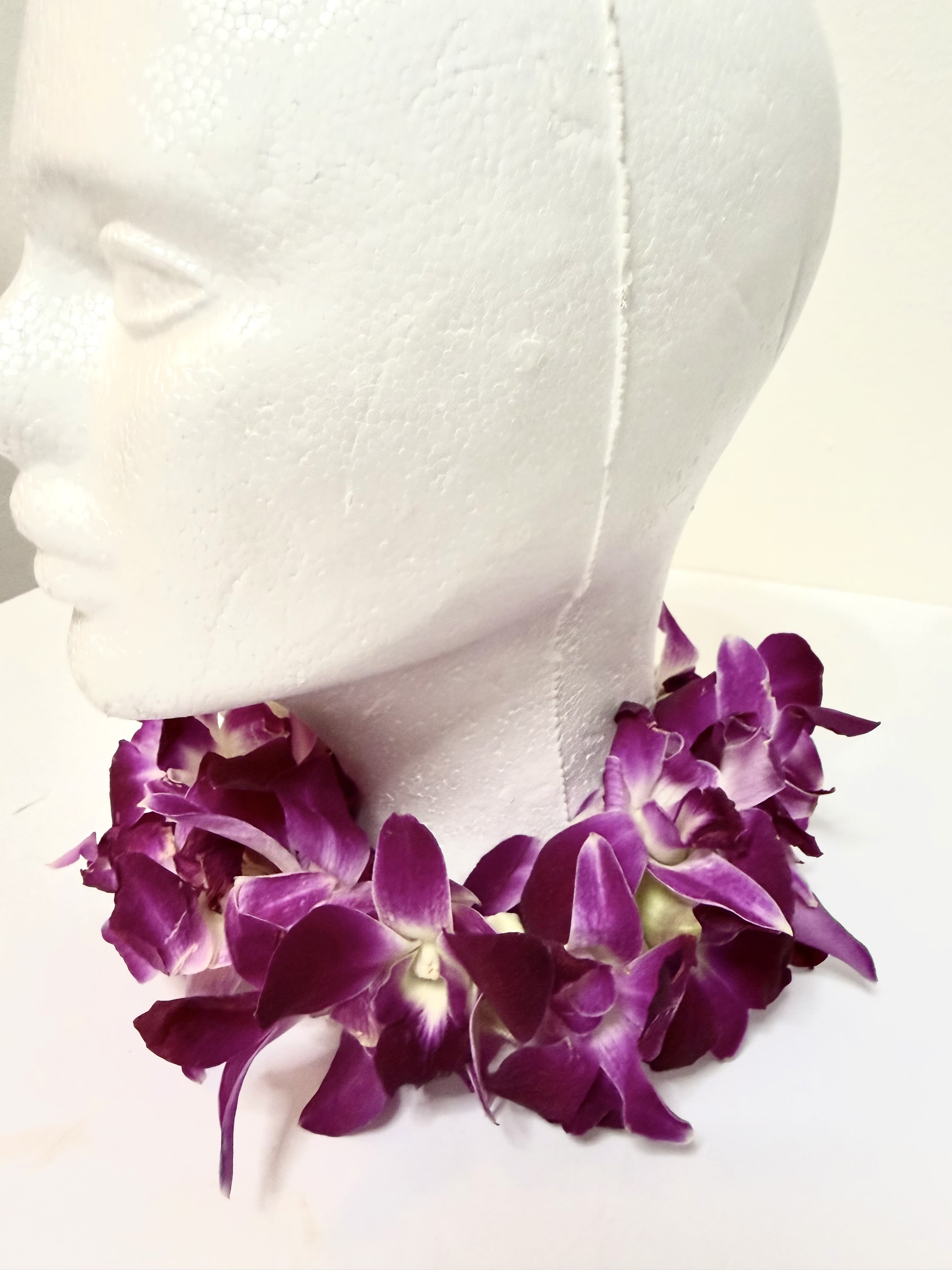Floral Necklace - A  fresh flower necklace radiates elegance with its soft, delicate petals. Handcrafted with care, it brings a natural fragrance and graceful charm to any occasion. Perfect for celebrations, it symbolizes beauty, purity, and timeless freshness . This orchid necklace is 12 inches long. Please give us call before you order this necklace to check availability .